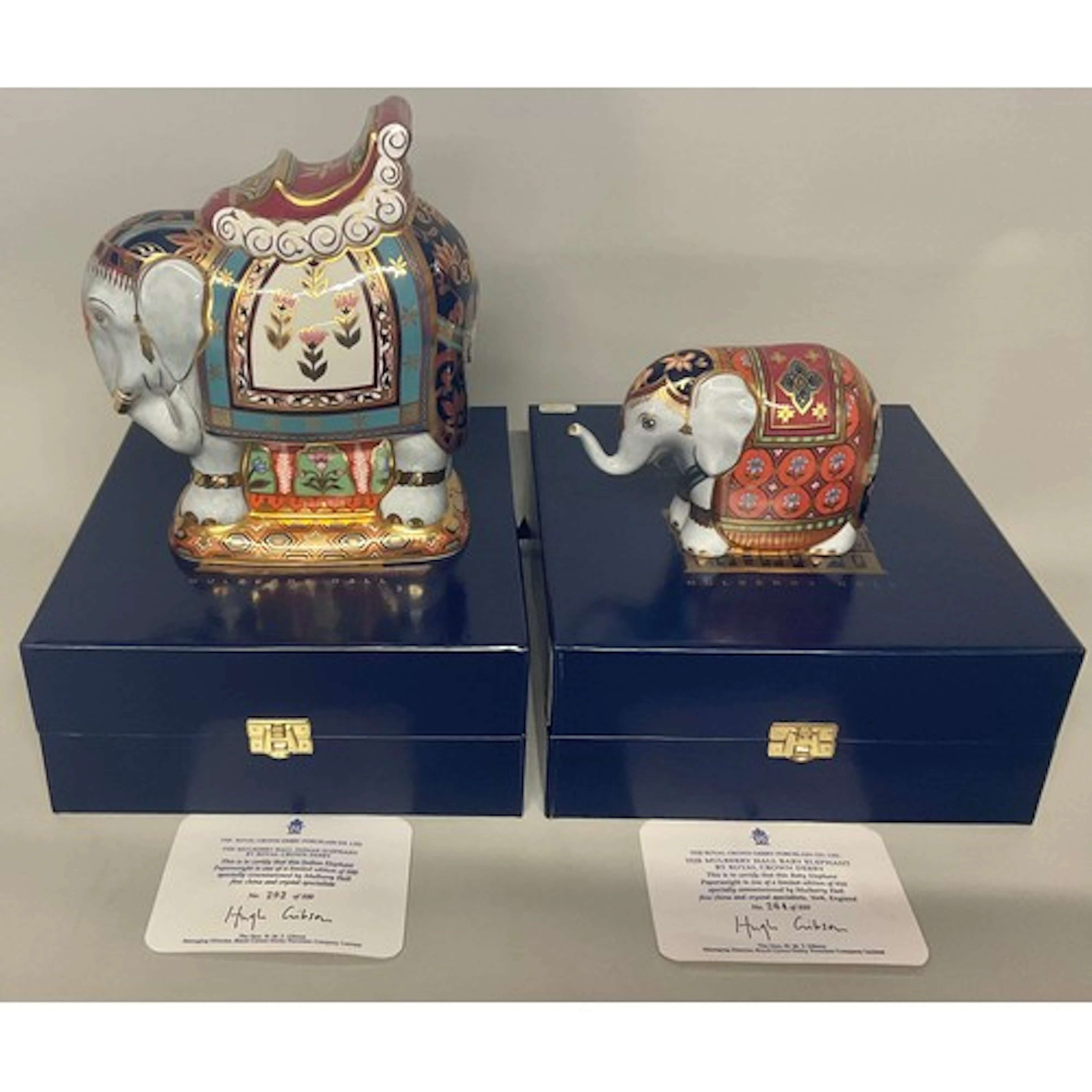 A Royal Crown Derby paperweight matched family group, compri...