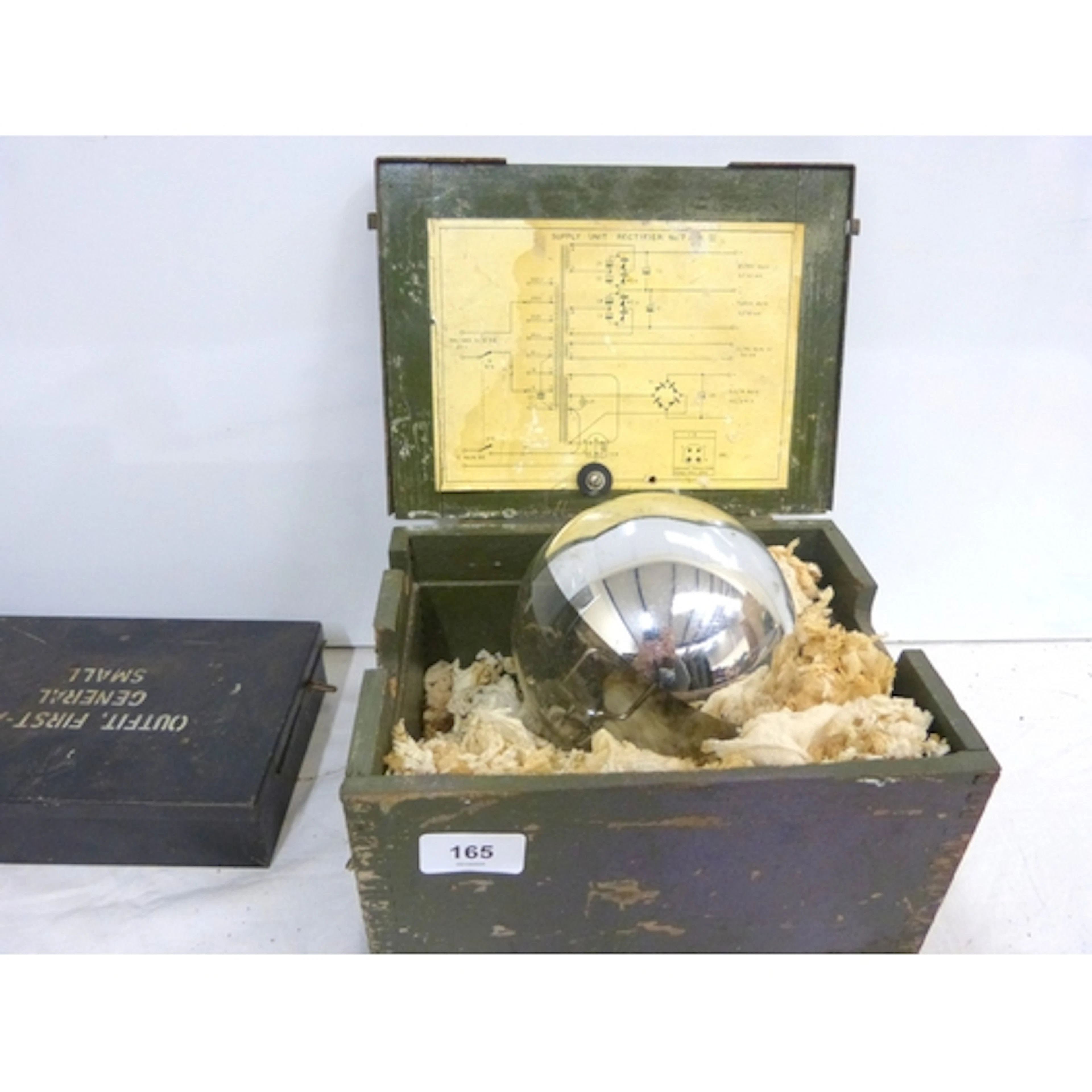 Military search light bulb and two army first aid boxes.