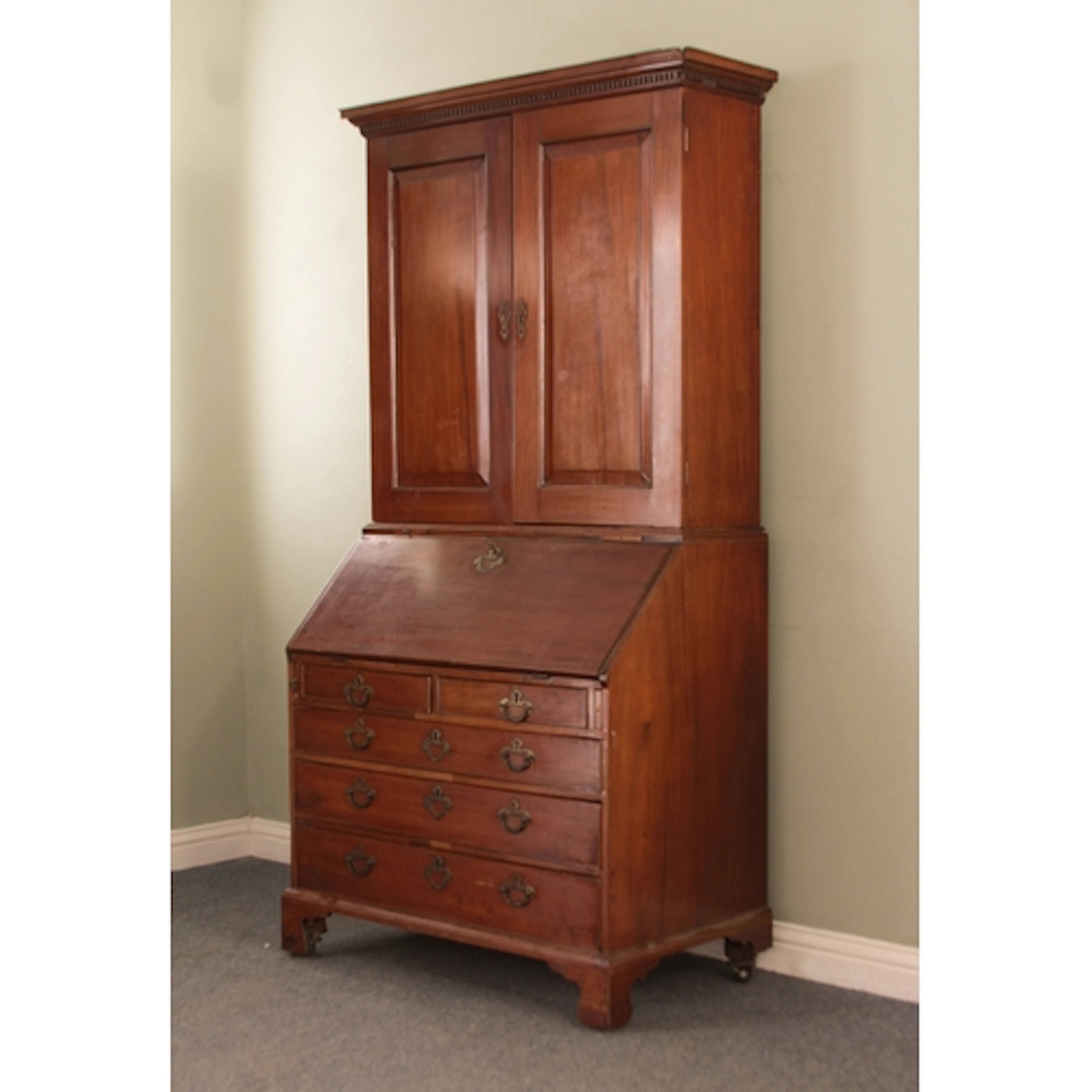 A George III mahogany bureau bookcase - the dentil cornice o...