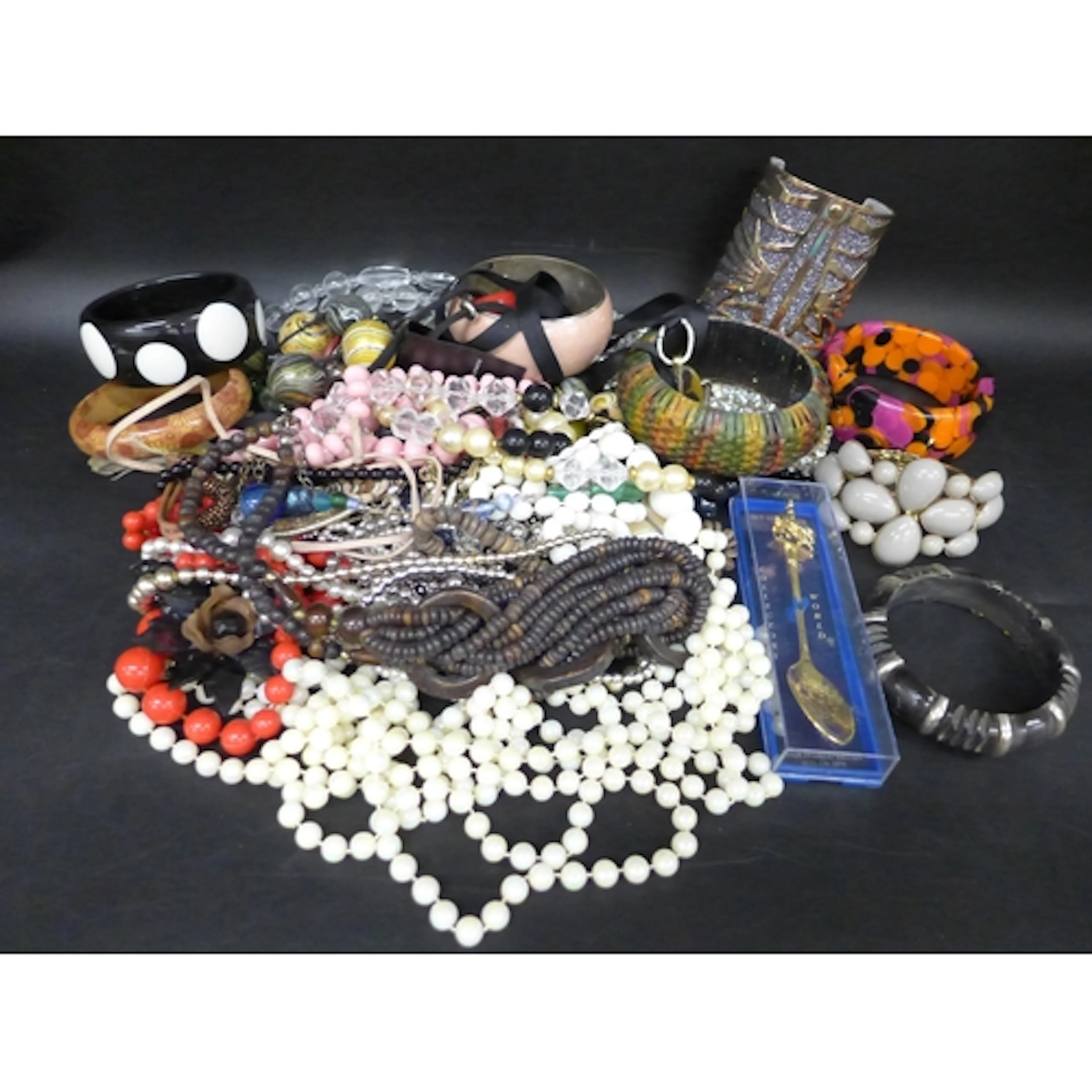 A collection of costume jewellery to include necklaces, bang...