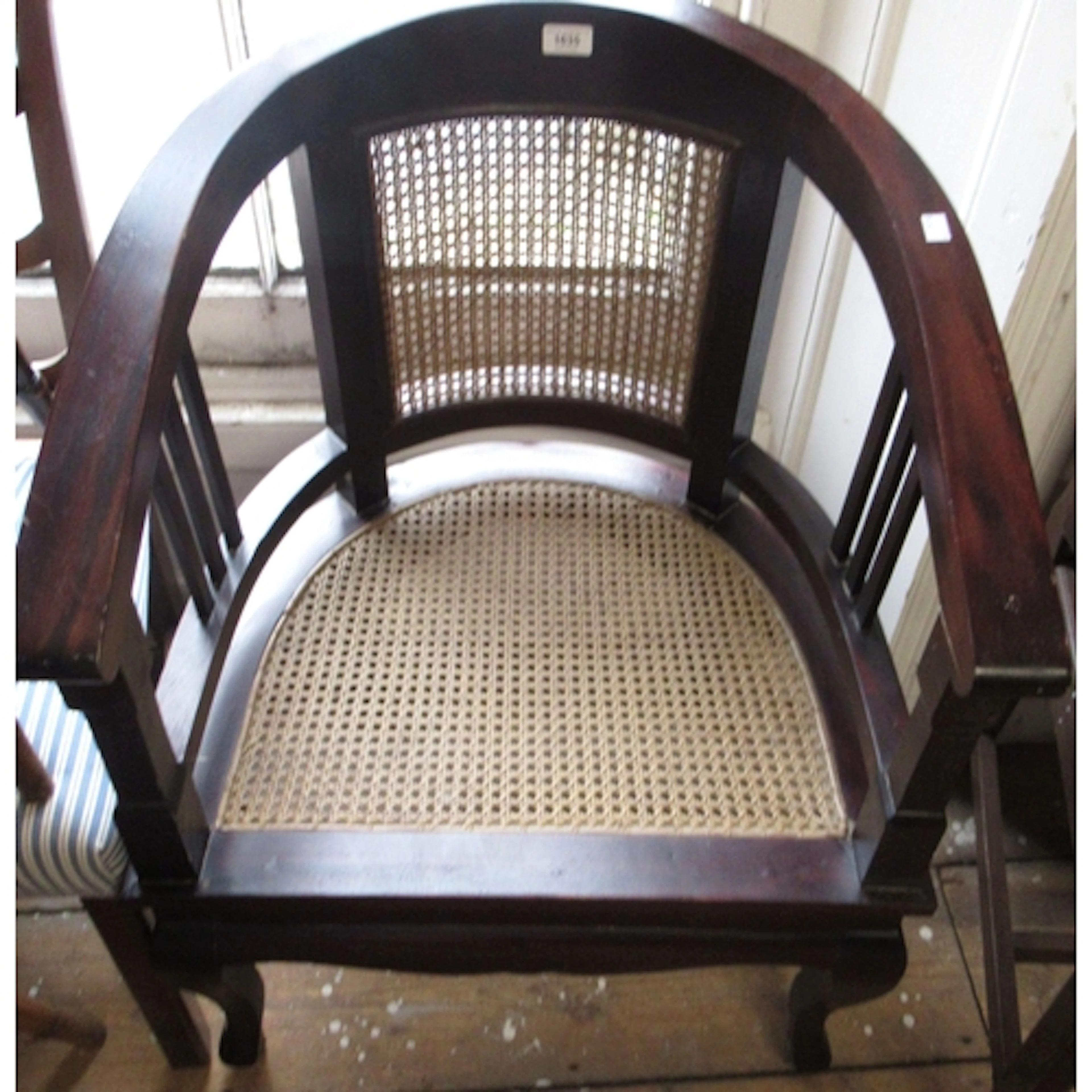 Late 20th Century hardwood bow back armchair, with cane back...