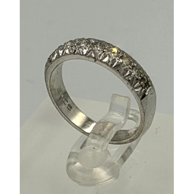 An 18ct white gold part eternity ring approximate size L and...