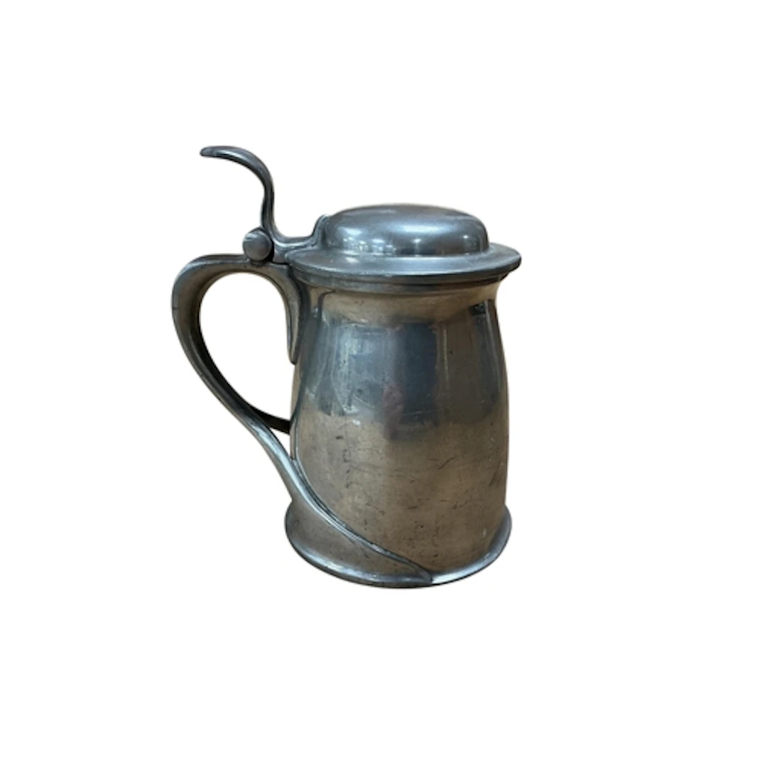 An Archibald Knox pewter tankard, height 17cm.