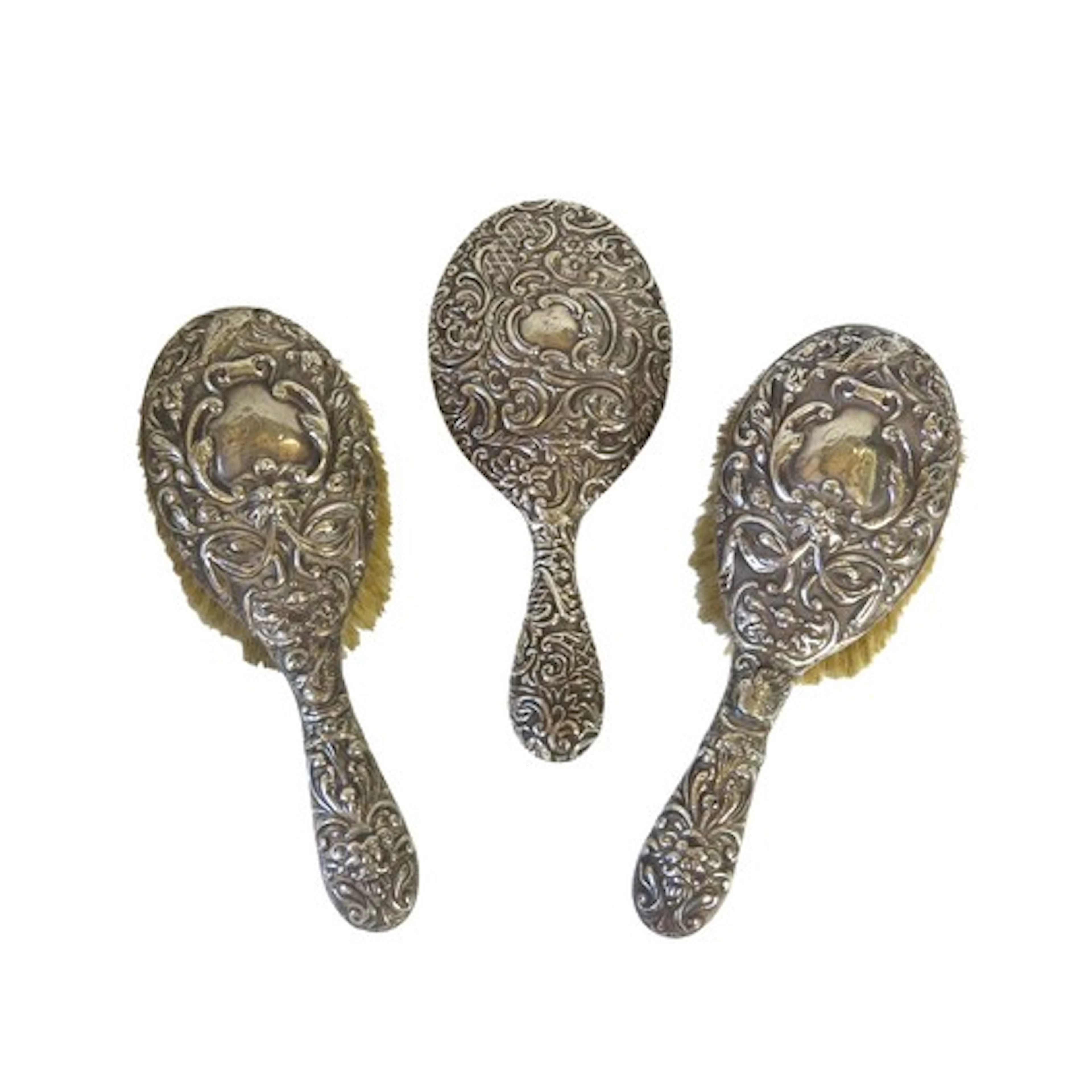 A PAIR OF EDWARDIAN SILVER BACKED BRUSHES BIERMINGHAM 1907 m...