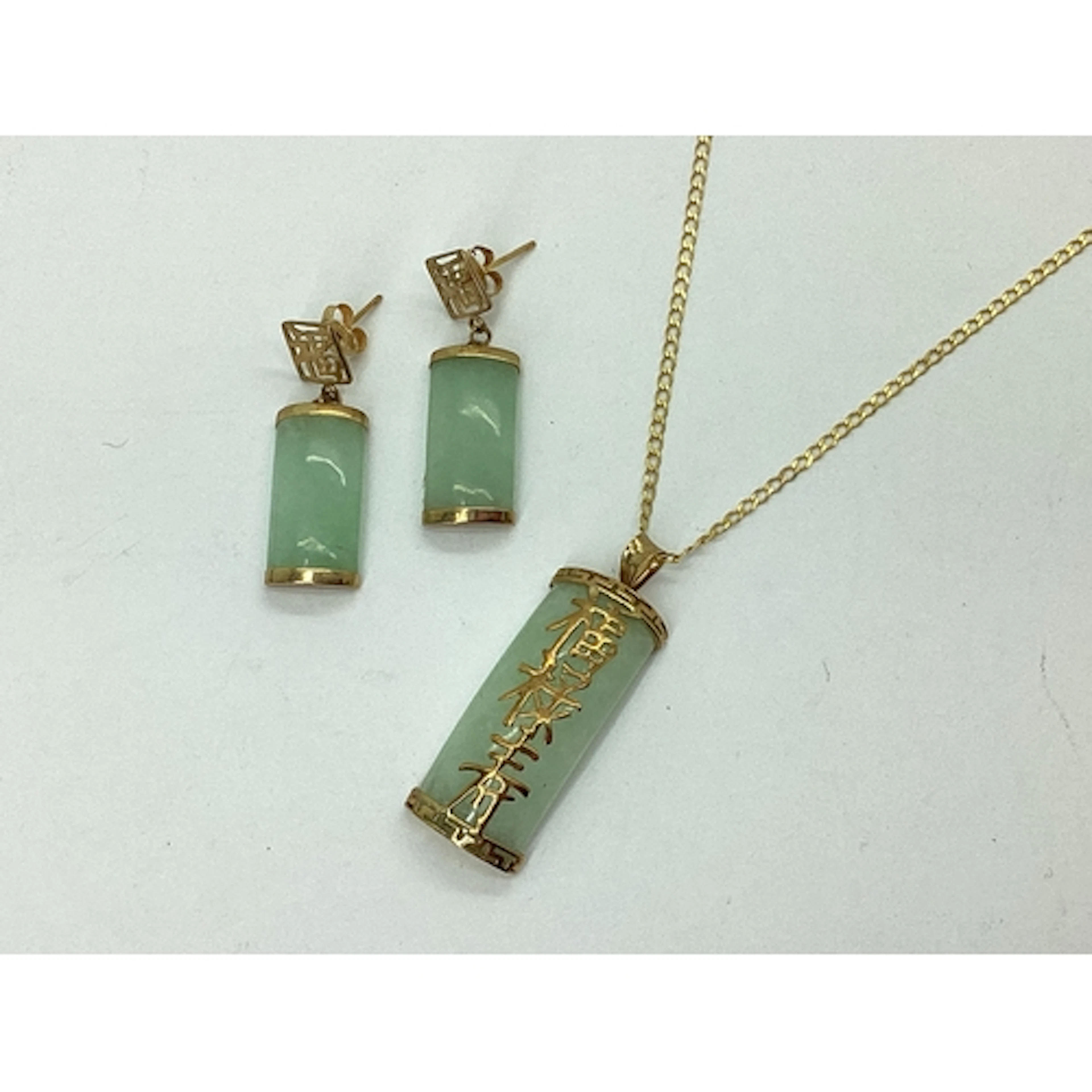 A Modern Jade Pendant, with applied Chinese symbols, stamped...