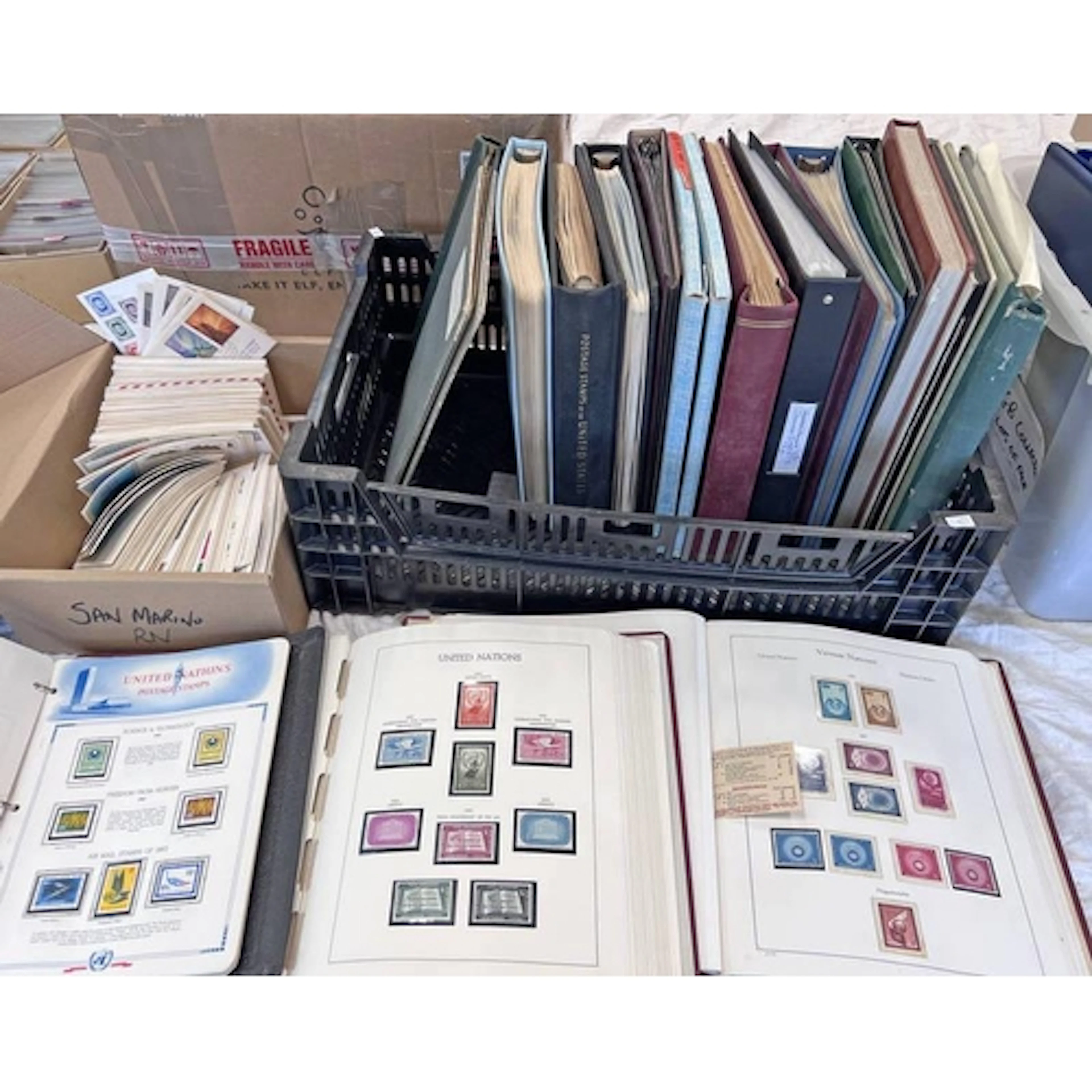 18 ALBUMS OF WORLDWIDE STAMPS, MOSTLY UNITED NATIONS ISSUES,...