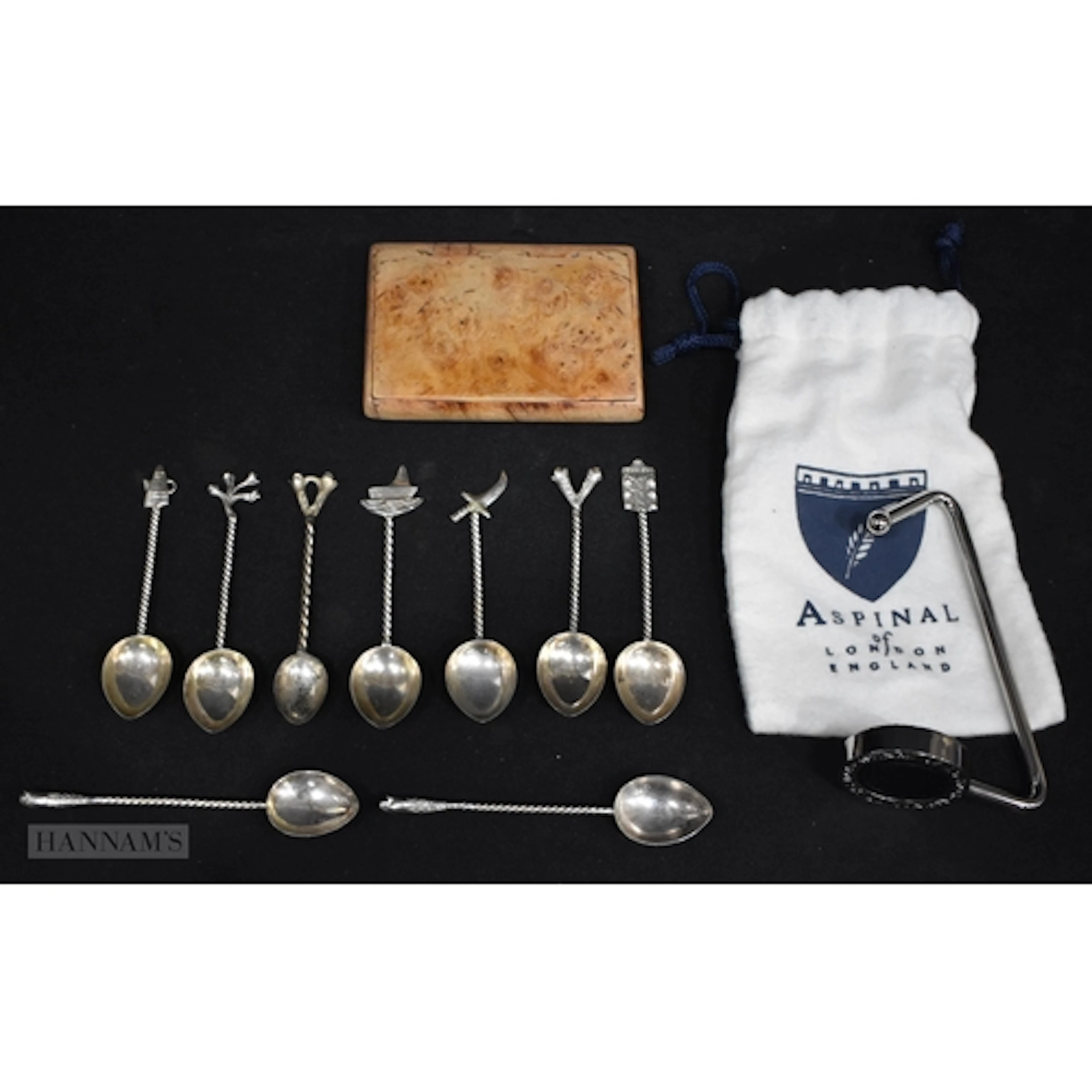 An Aspinal of London handbag holder together with a set of t...