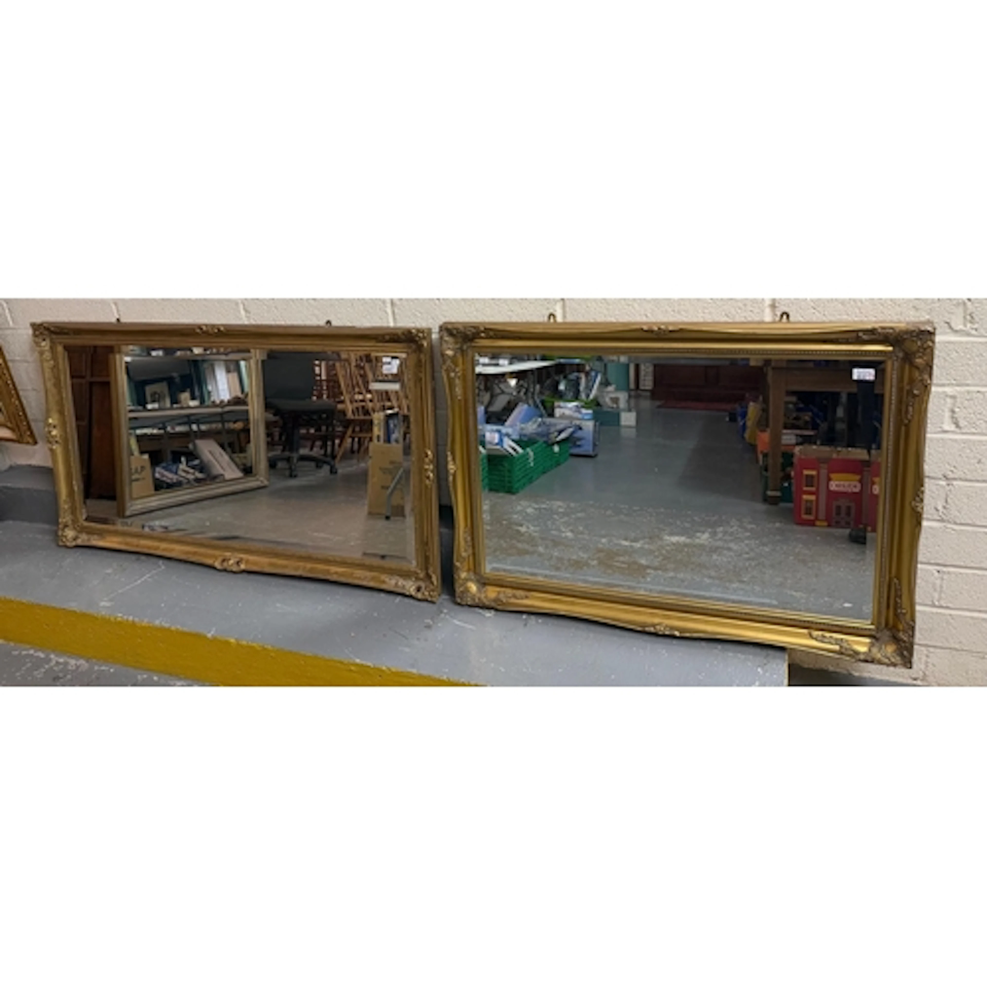Modern gilt framed rectangular mirror with bevelled plate. O...
