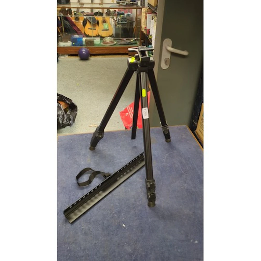 Folding black metal music stand with an adjustable tripod ba...