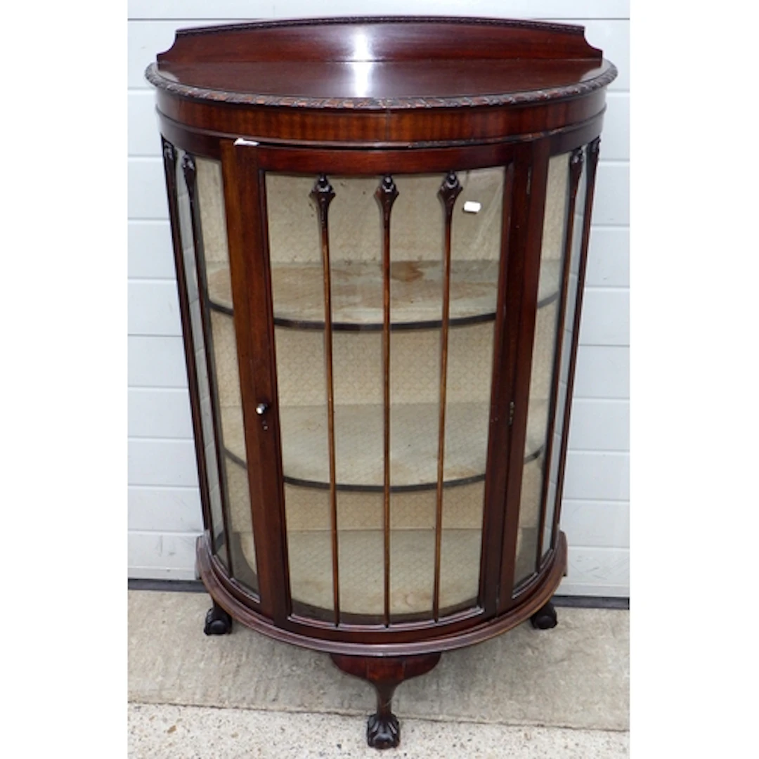 A 1920's bowfronted mahogany China cabinet, missing some mou...