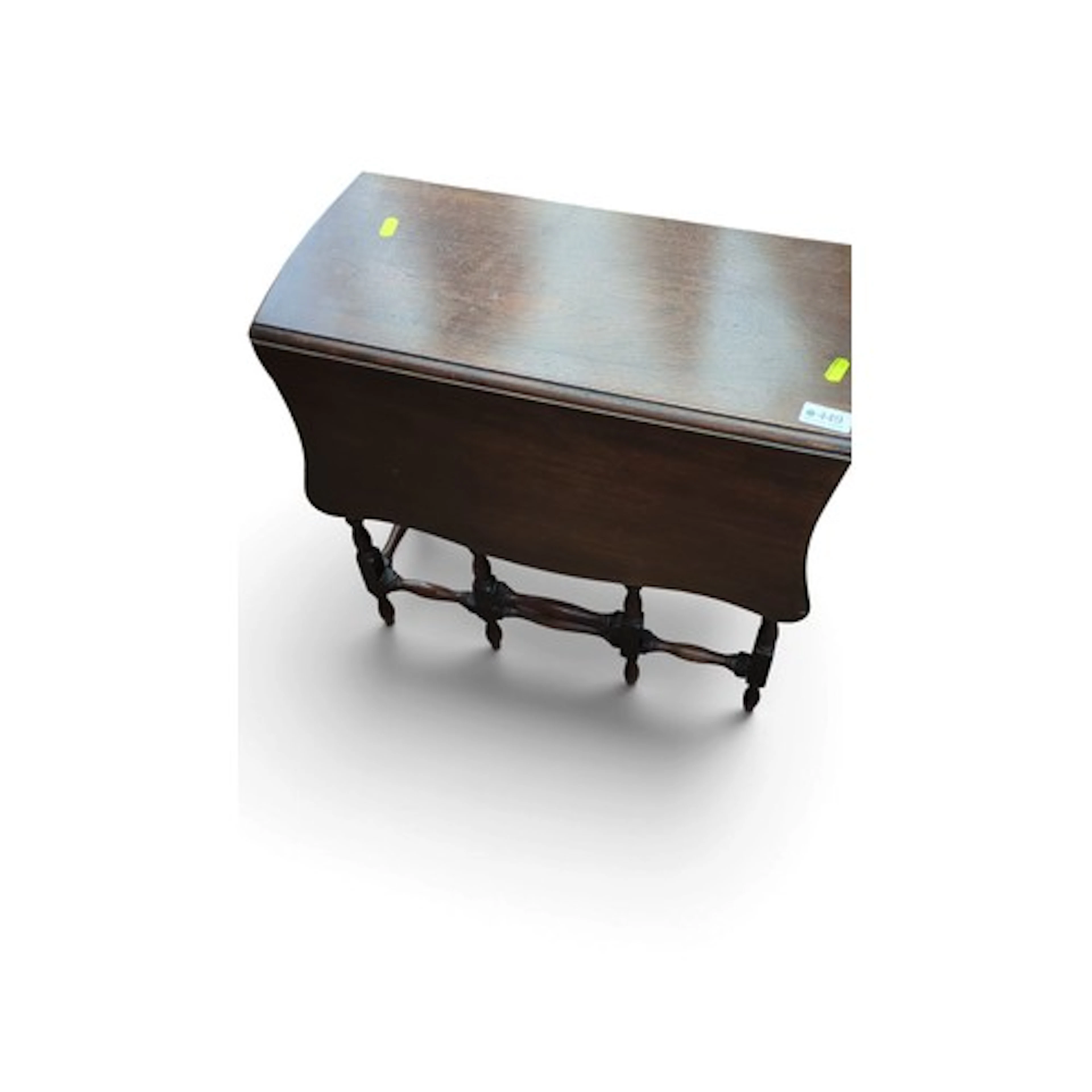 Gateleg dining table in dark-stained wood, with shaped drop ...
