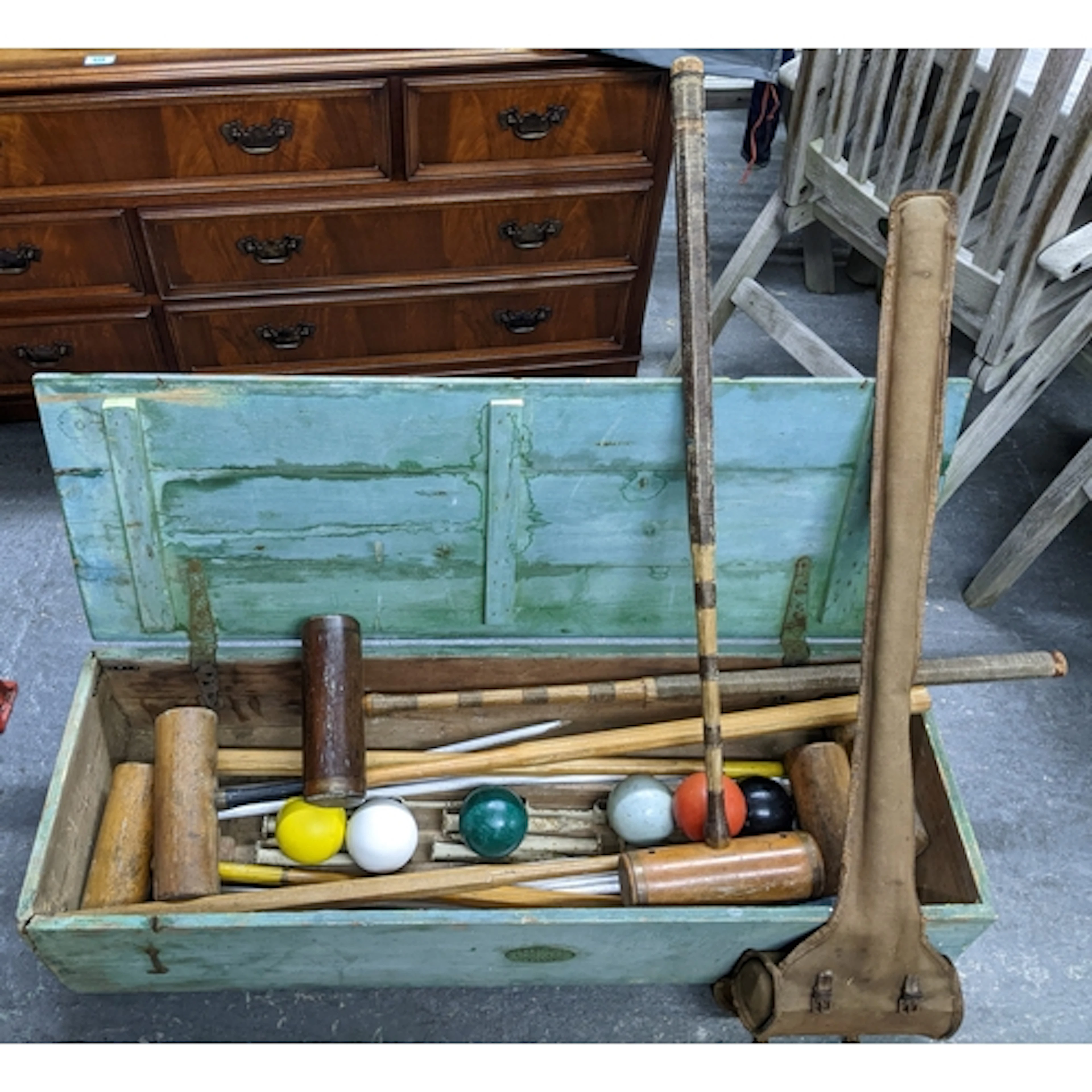 A green painted wooden croquet box with a George Bussey & Co...