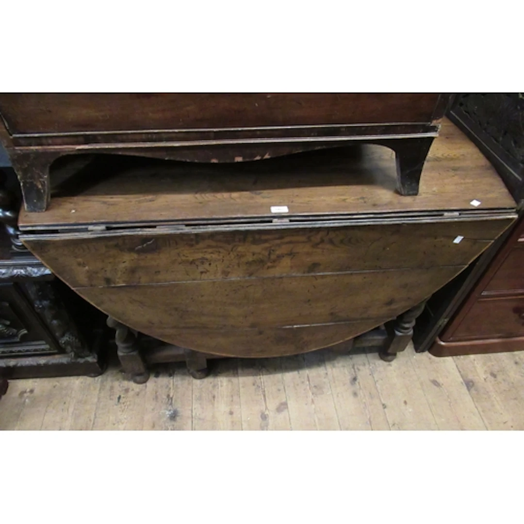 Antique oak gate-leg oval drop-leaf table, on barley twist s...