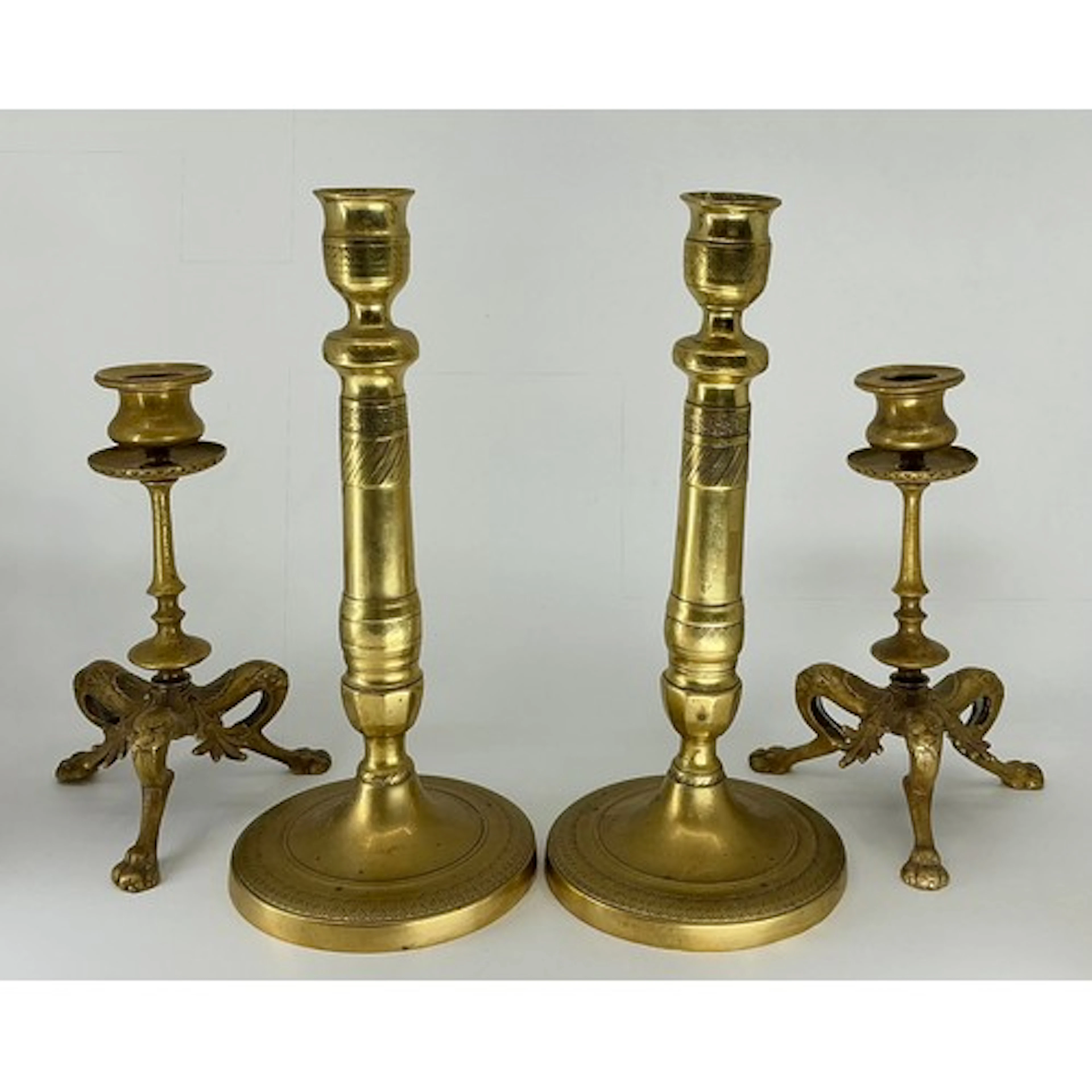 A pair of French Second Empire Candlesticks, lion-paw tripod...