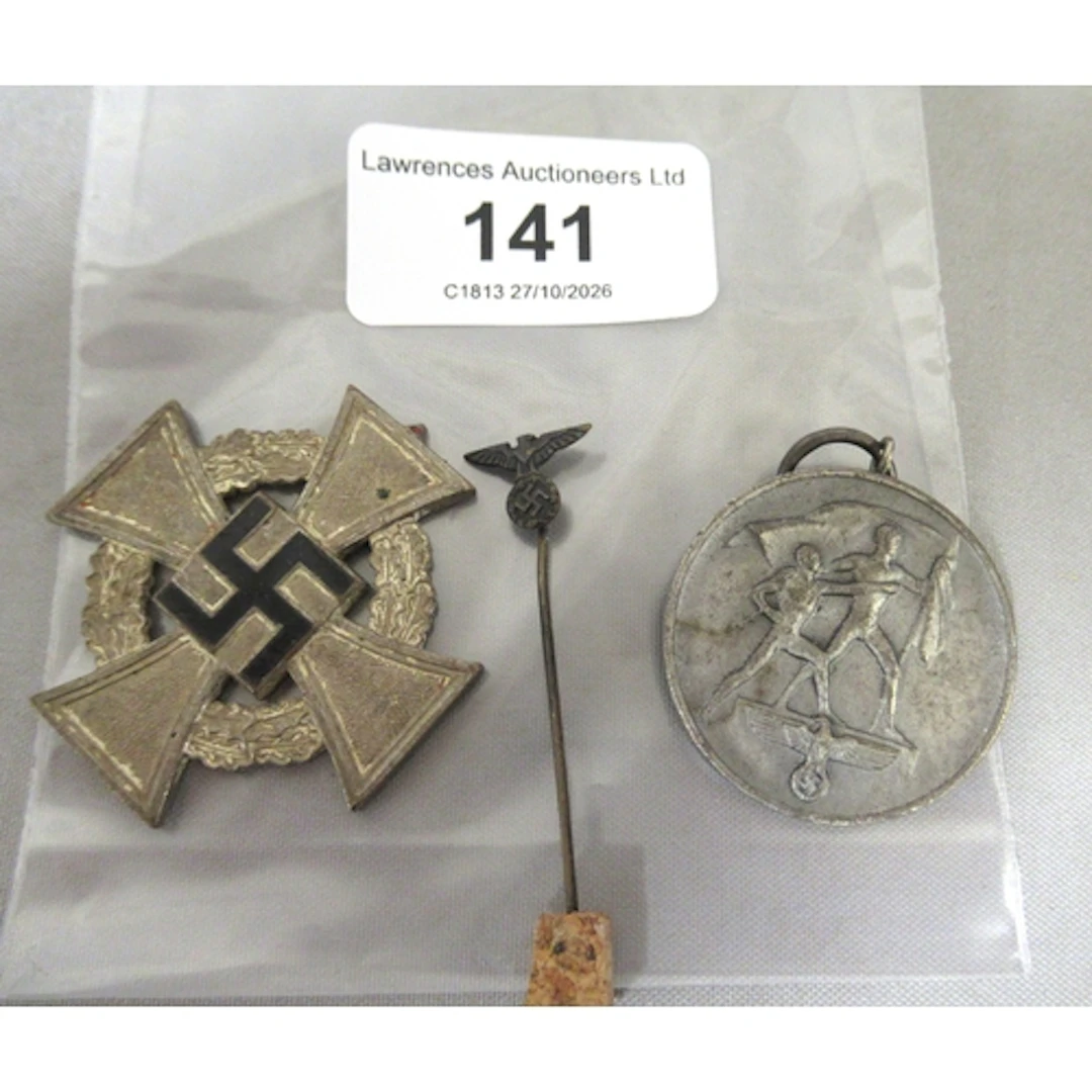 German 1938 medal, a WWII medal (at fault) and a German tie ...