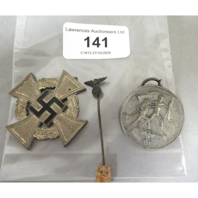 German 1938 medal, a WWII medal (at fault) and a German tie ...