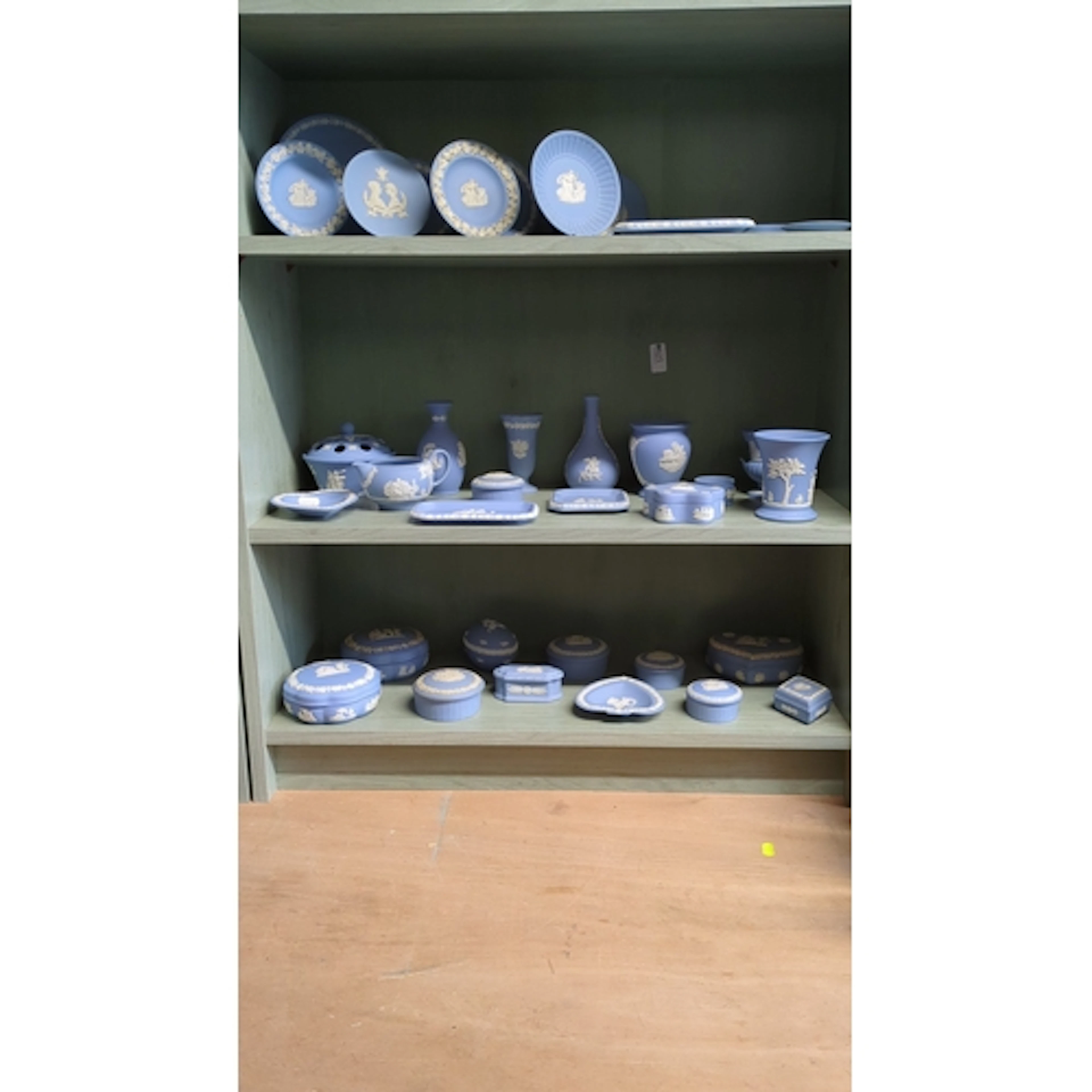 3 shelves of Wedgwood jasperware in lilac-blue with white cl...