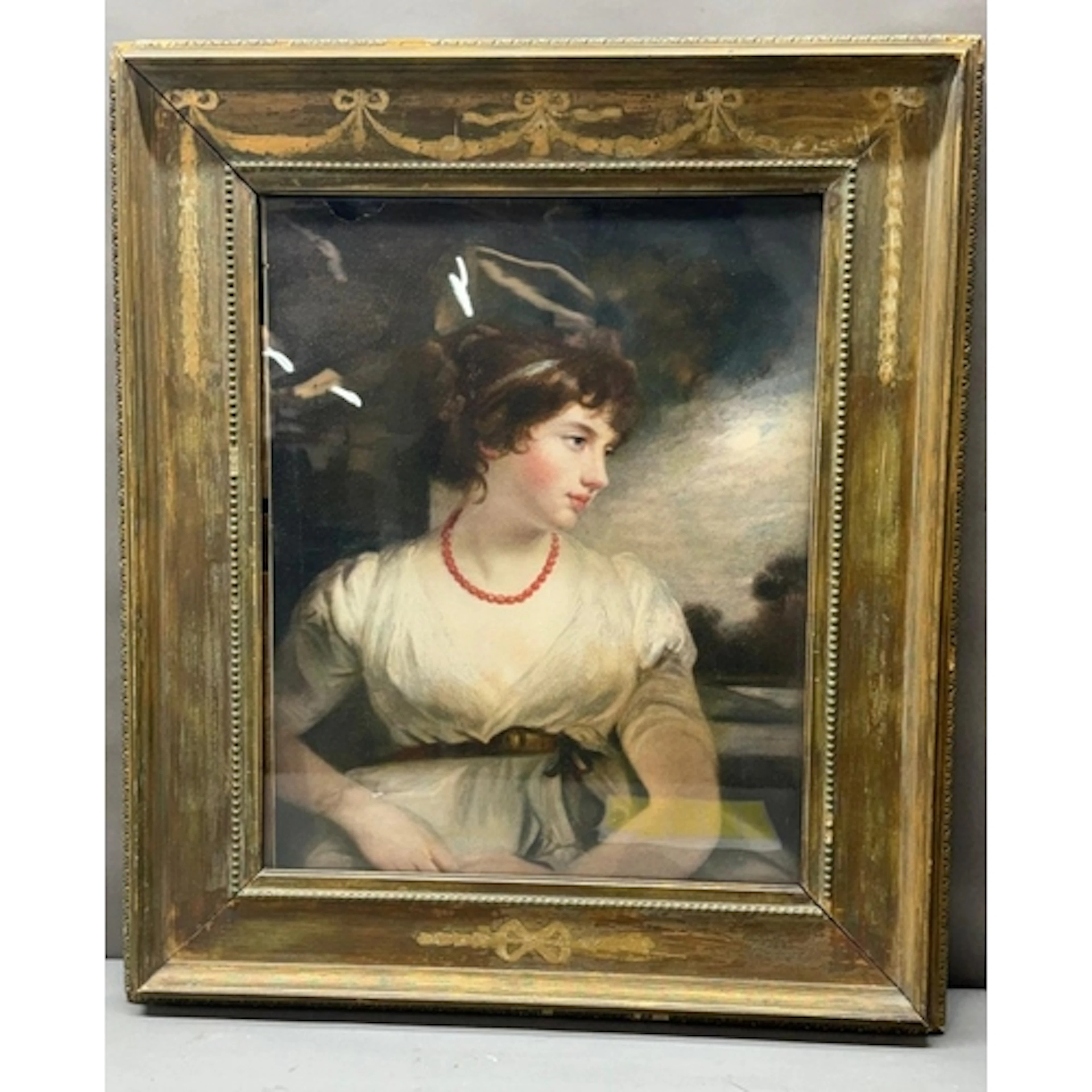 An oil on paper of a victorian lady looking to her left...