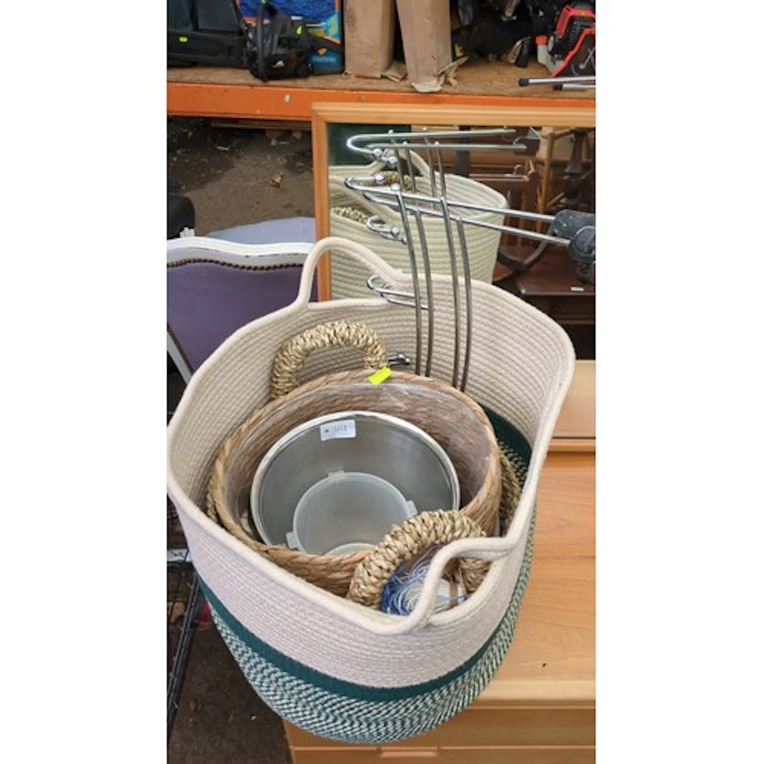 A group of contemporary storage baskets in coiled cotton rop...