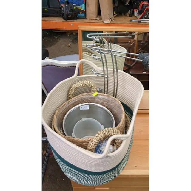 A group of contemporary storage baskets in coiled cotton rop...