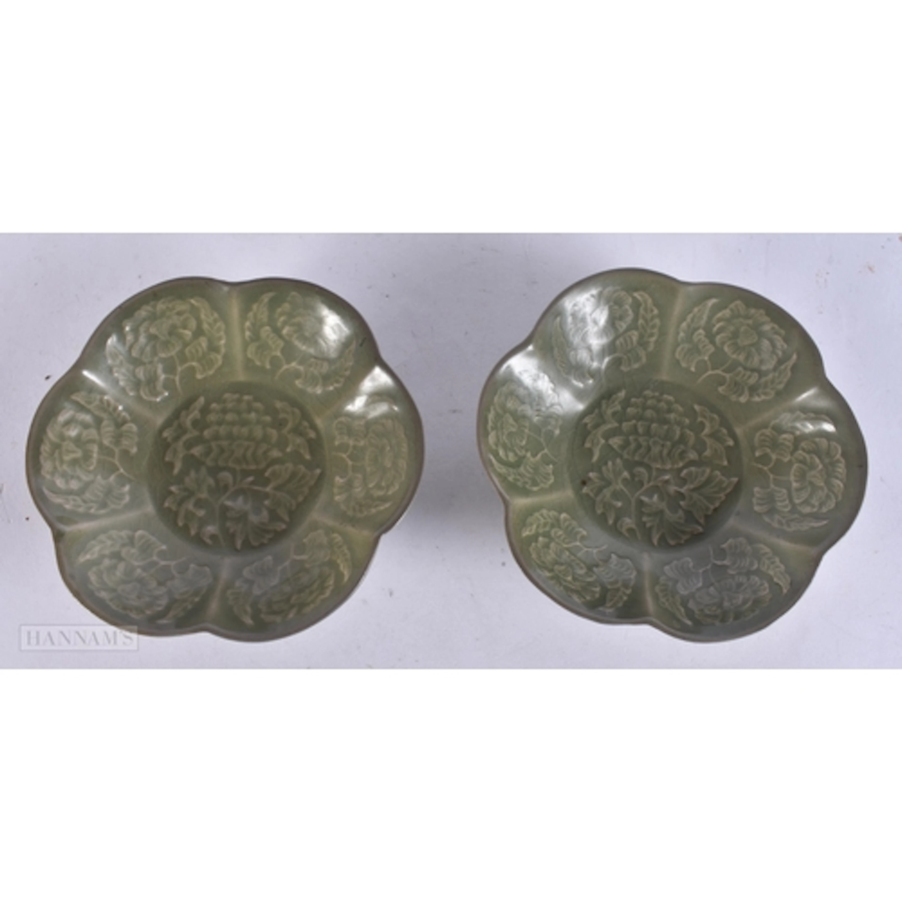 A PAIR OF CHINESE CELADON GLAZED YAOZHOU FLORAL MOULDED DISH...