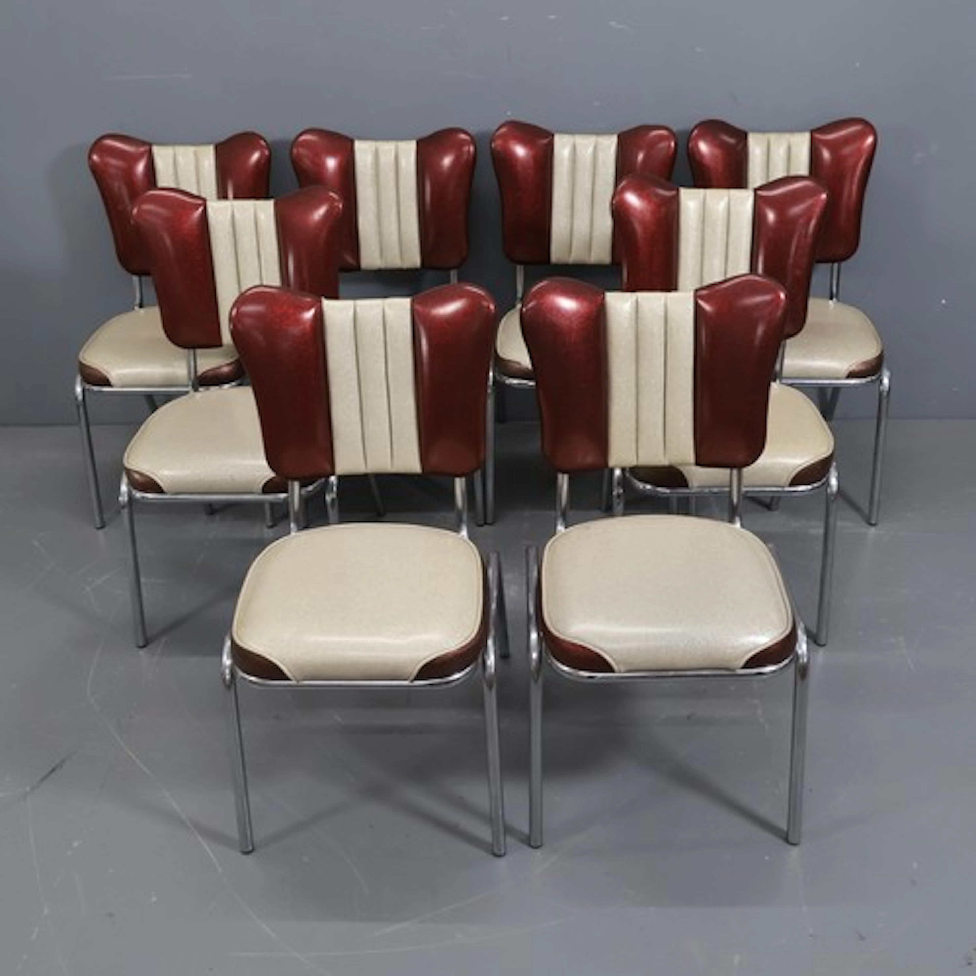 A set of eight vintage 1950s style American diner chairs, wi...