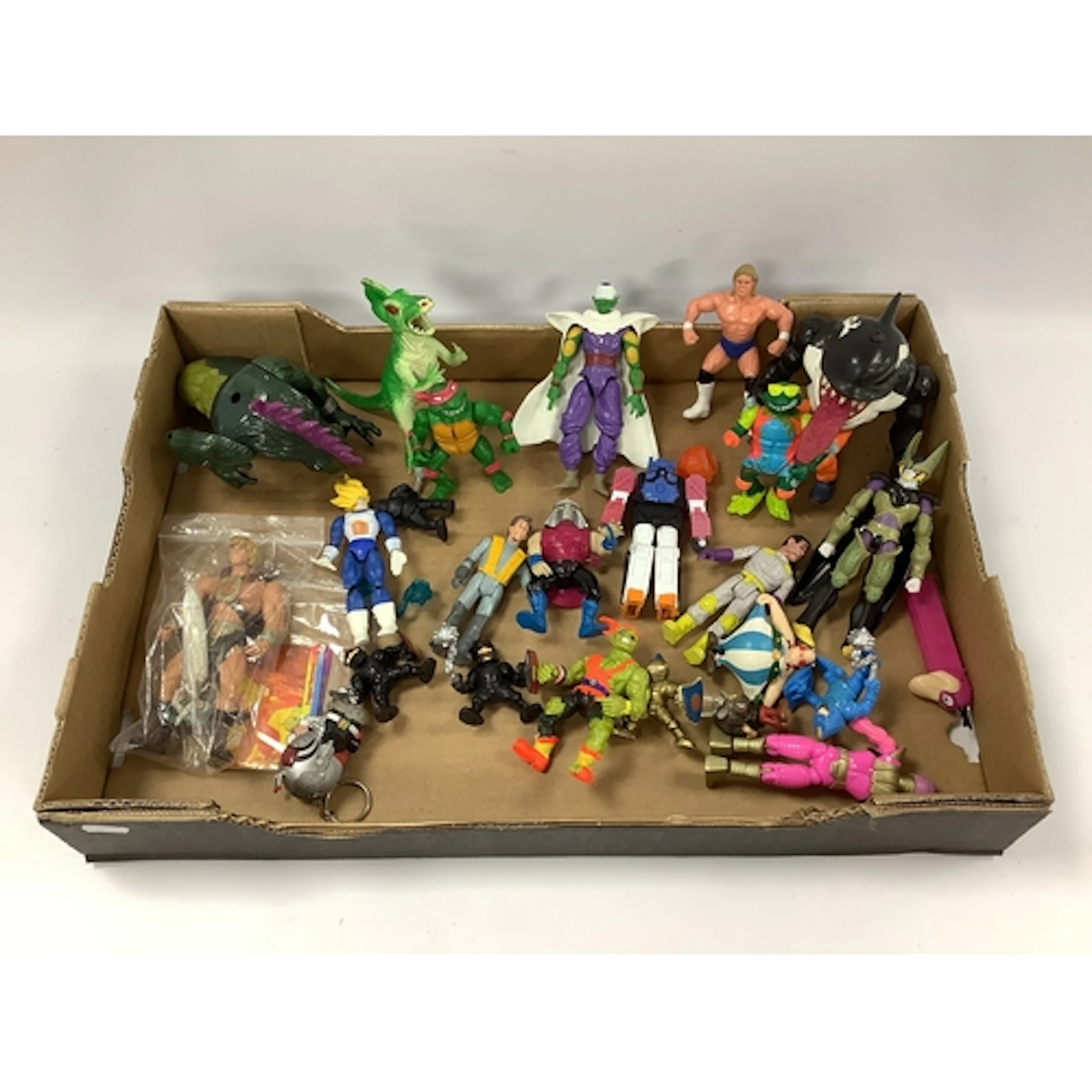 A quantity of plastic action figures. Themes include Ghostbu...