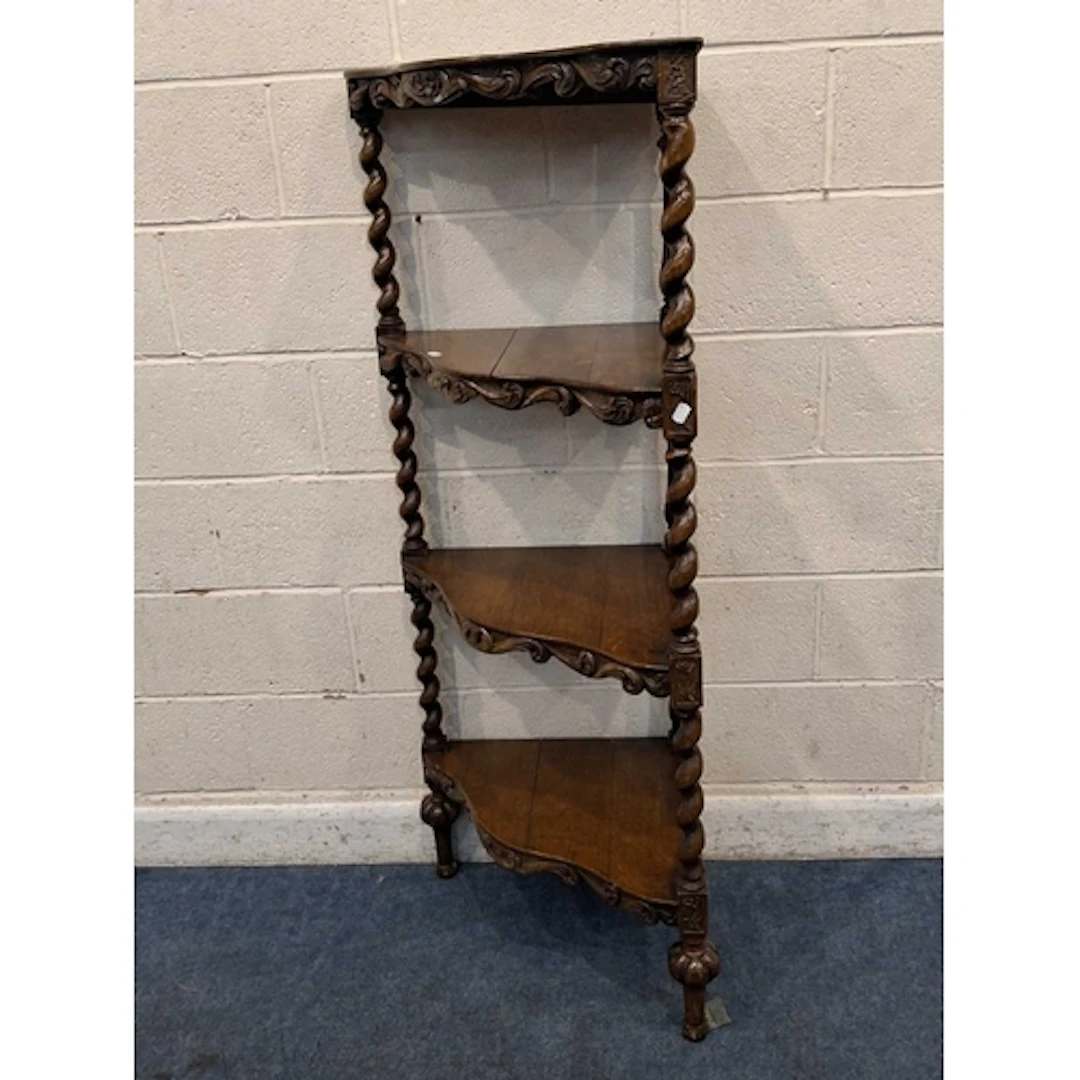 A 19TH CENTURY OAK FOUR TIER CORNER WHAT-NOT, with serpentin...