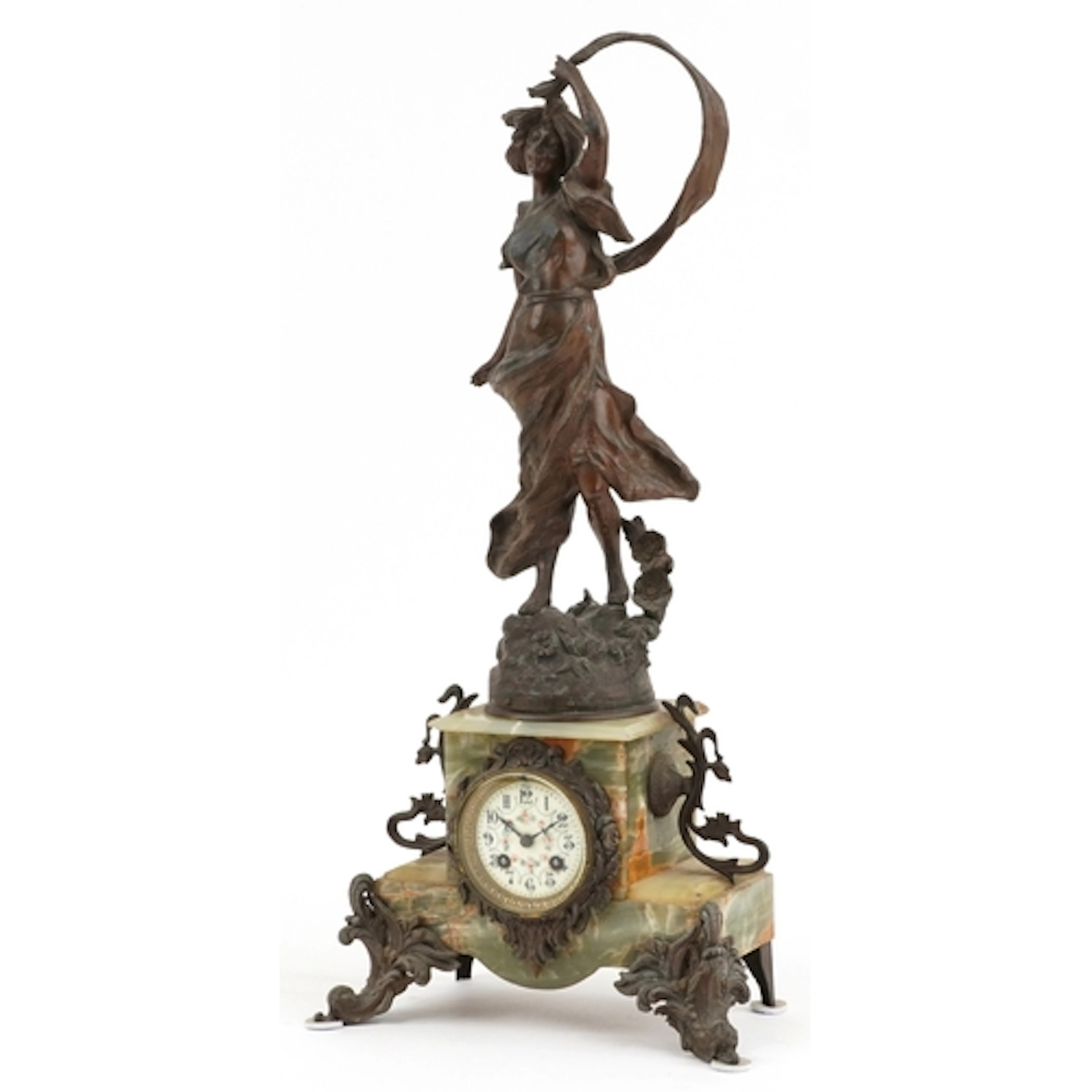 A French Art Nouveau spelter and onyx mantle clock mounted w...
