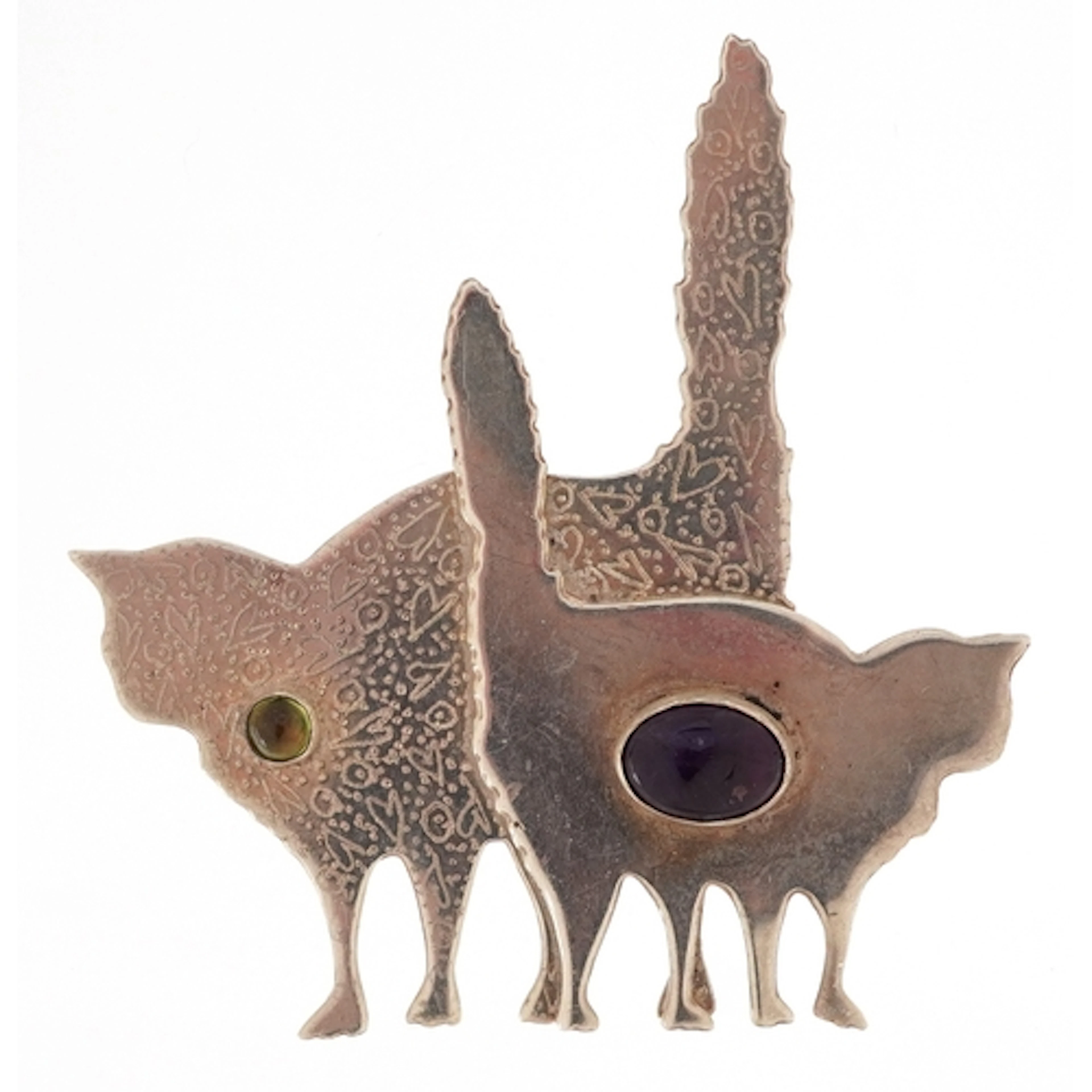 Modernist unmarked silver brooch in the form of cats set wit...