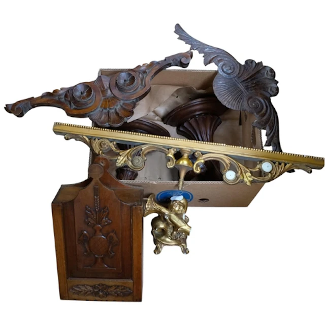 A pair of oak wall brackets, and another, a cherub candlesti...
