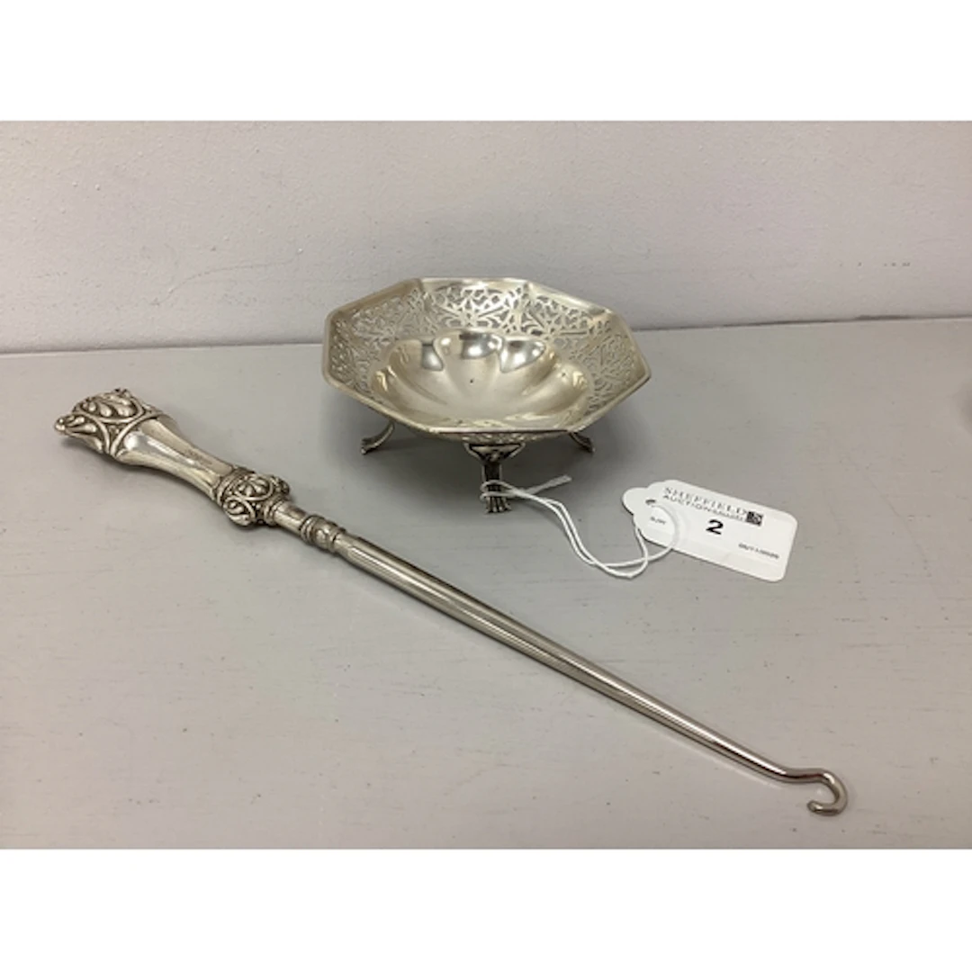 A Hallmarked Silver Handled Button Hook, together with a sma...