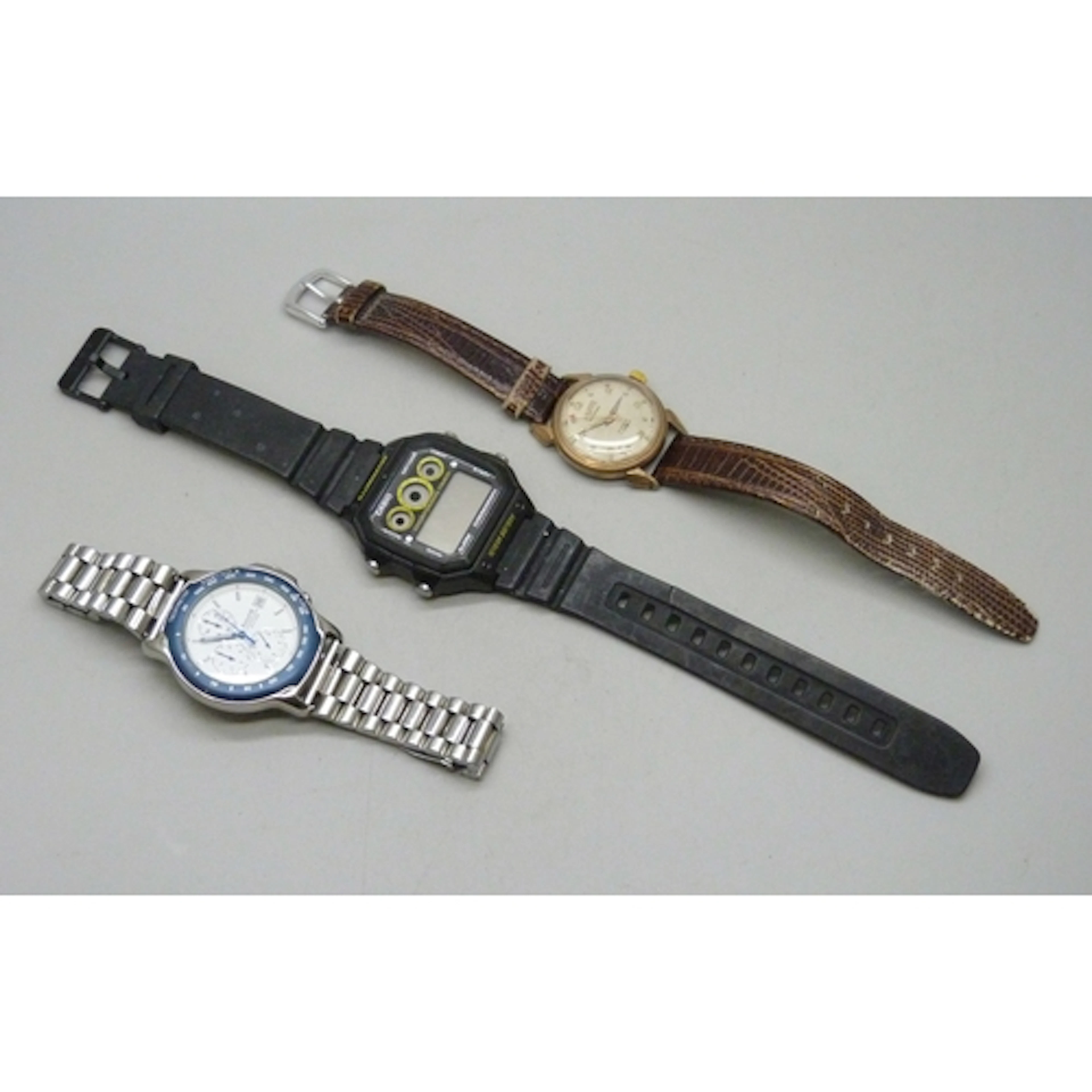 A Jenco wristwatch, an Accurist wristwatch, and a Casio wris...