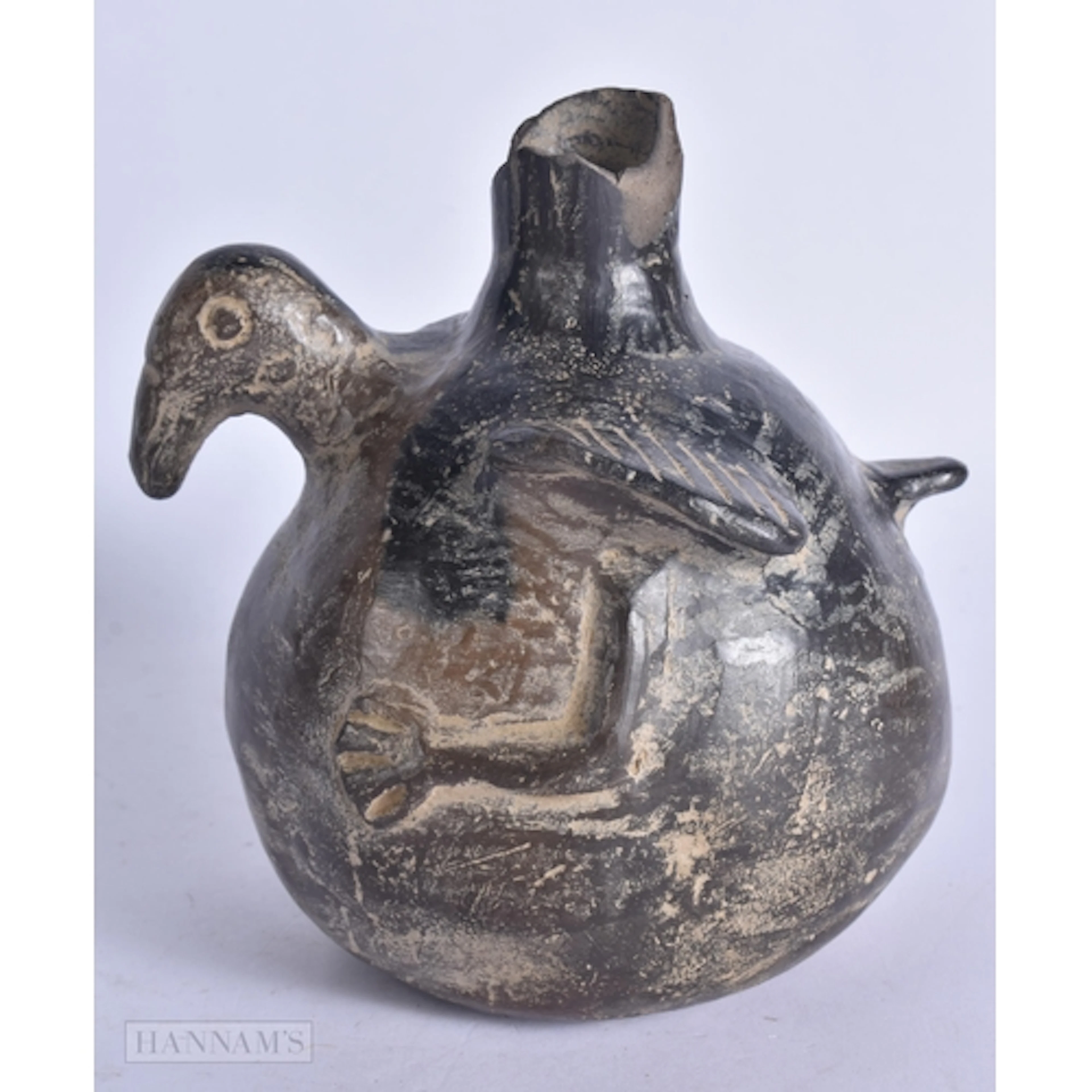 AN EARLY SOUTH AMERICAN TRIBAL POTTERY BIRD FORM VESSEL. 16 ...