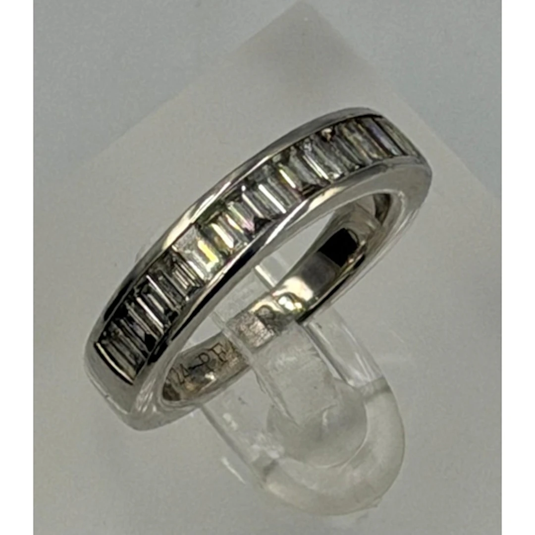 A white gold half eternity ring, approximate size J.5 and we...