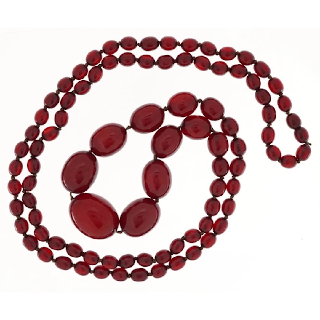 Cherry amber coloured graduated bead necklace, the largest b...