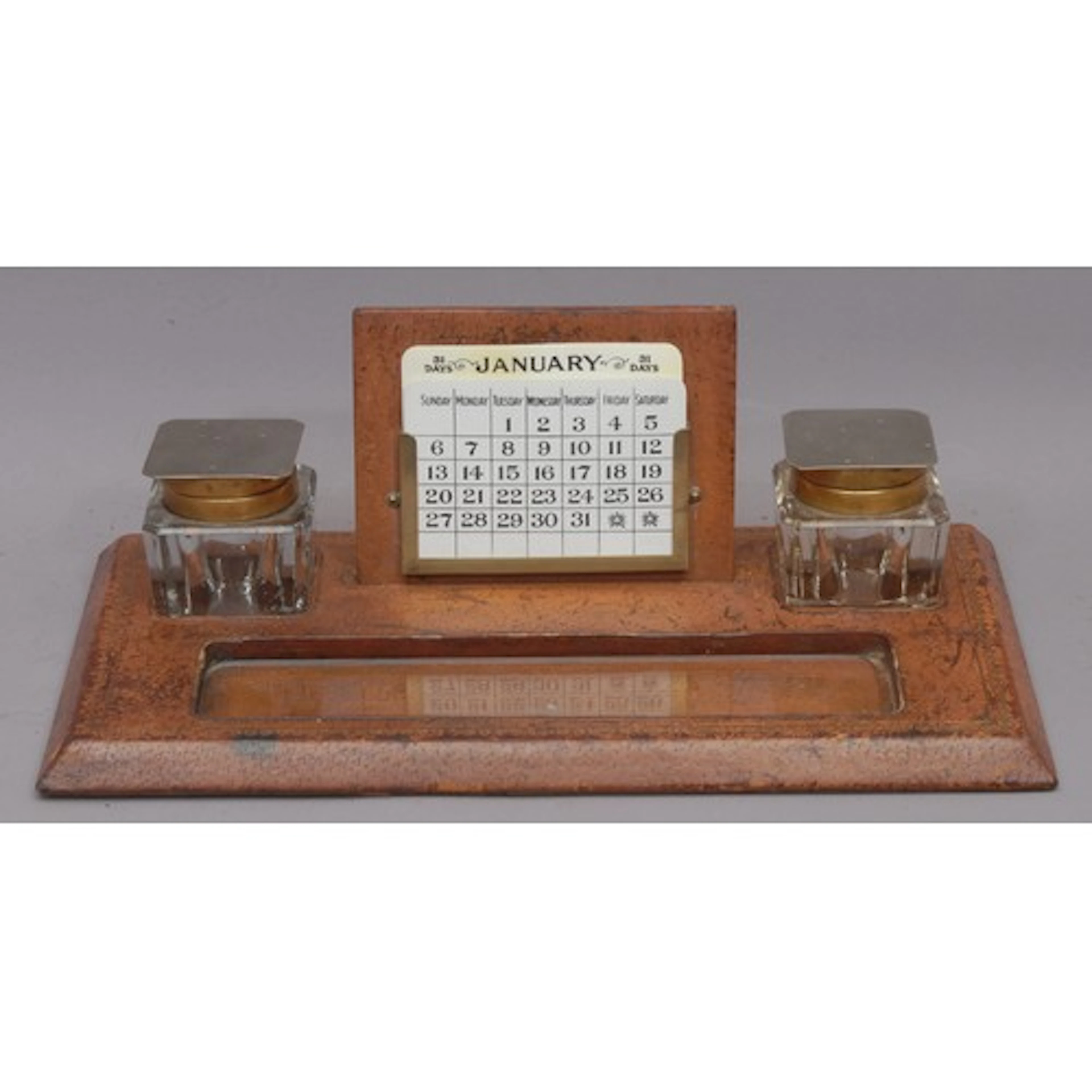 An Art Deco period tooled and gilt leather inkstand, central...