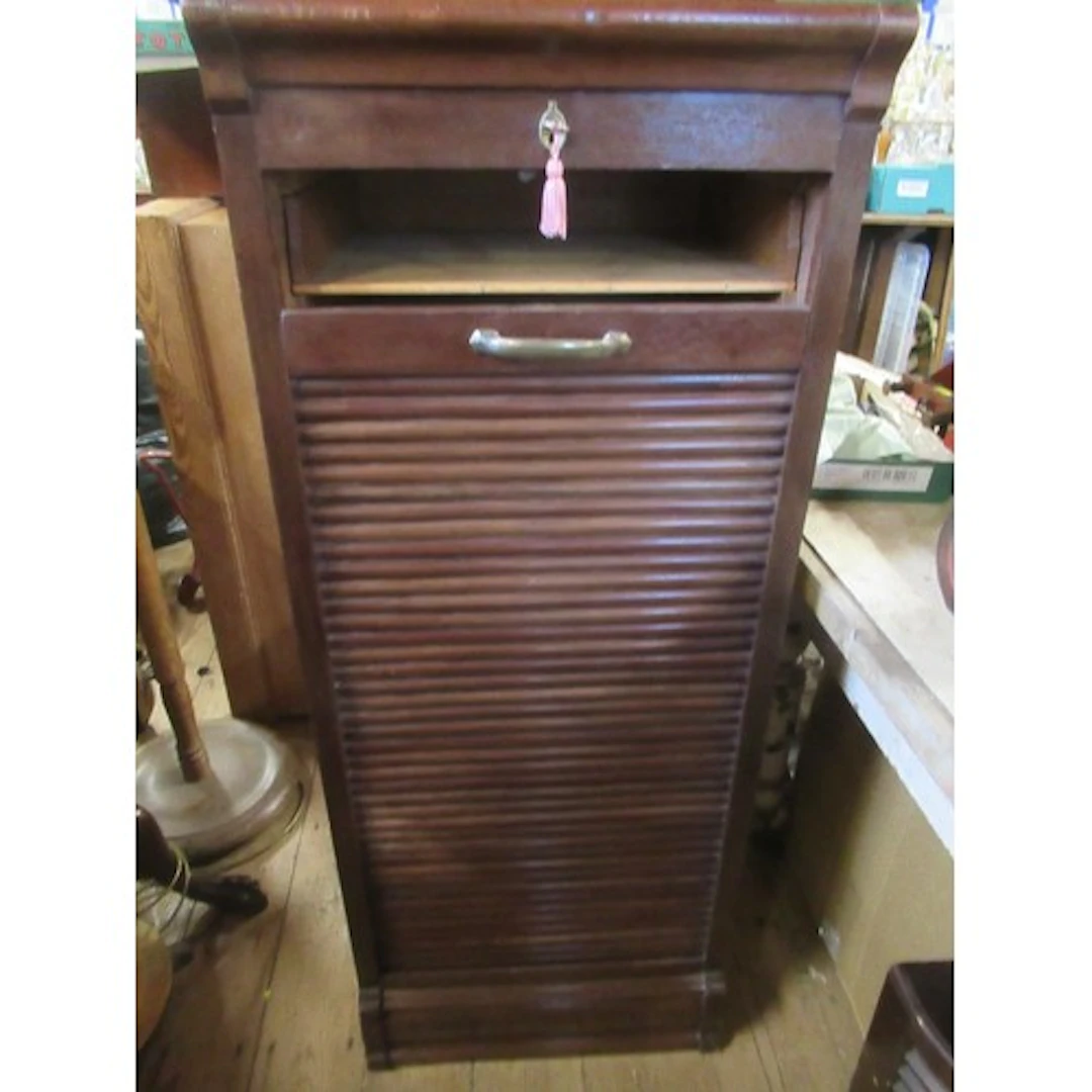 A filling cabinet with timbour front
