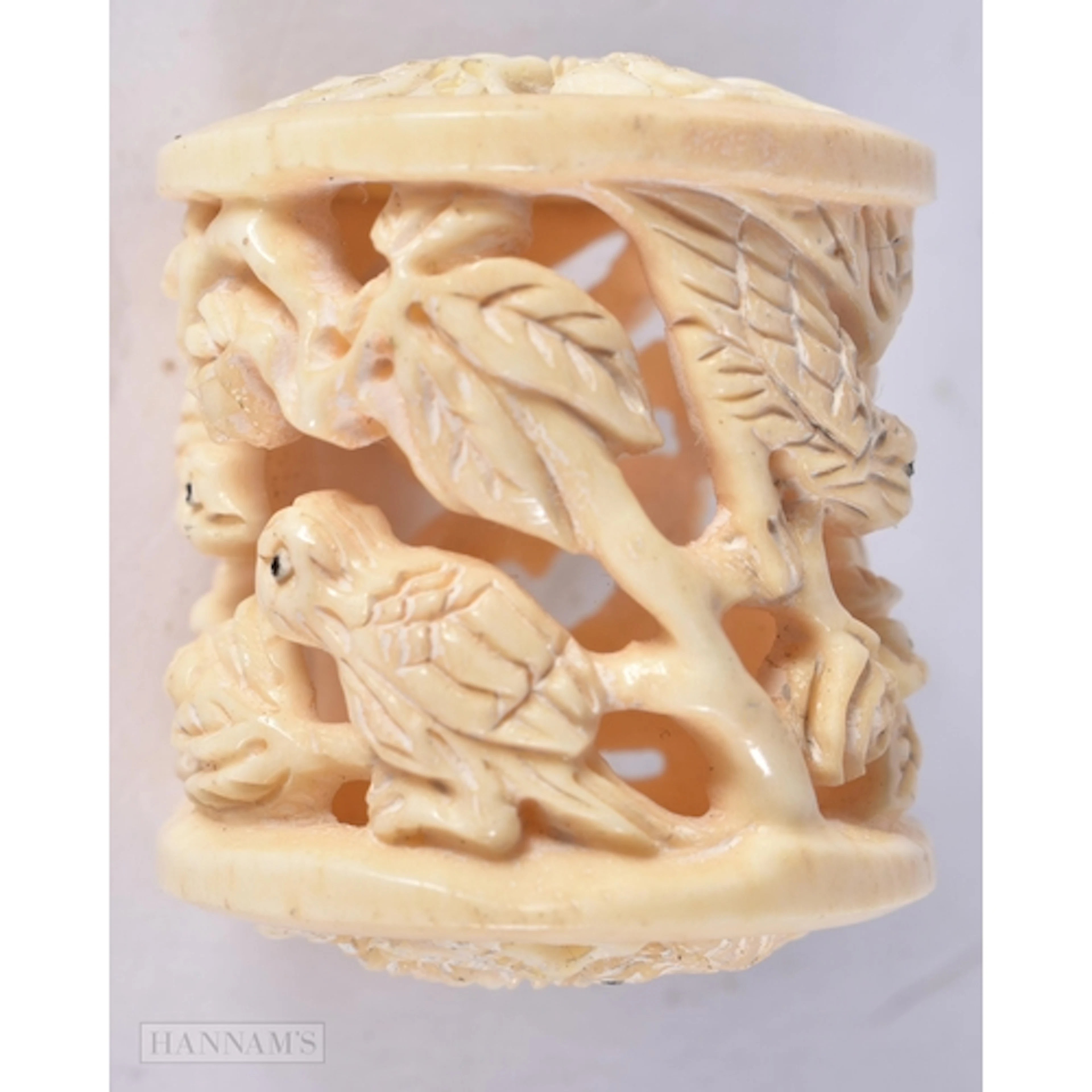 A BONE RETICULATED BIRD NETSUKE. 3.5 x 2.9 cm