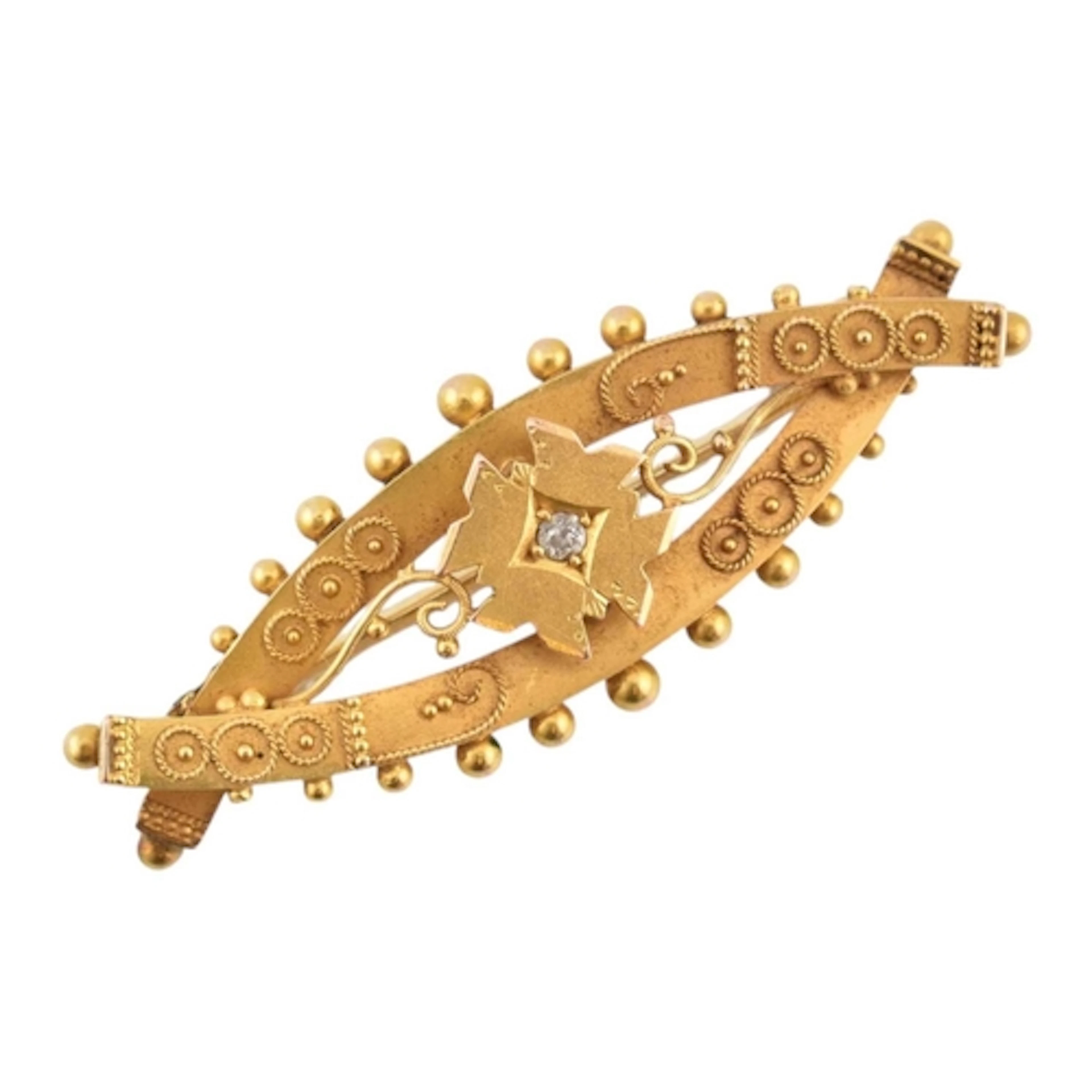 An 1890s hallmarked 15ct gold Victorian navette brooch pin. ...