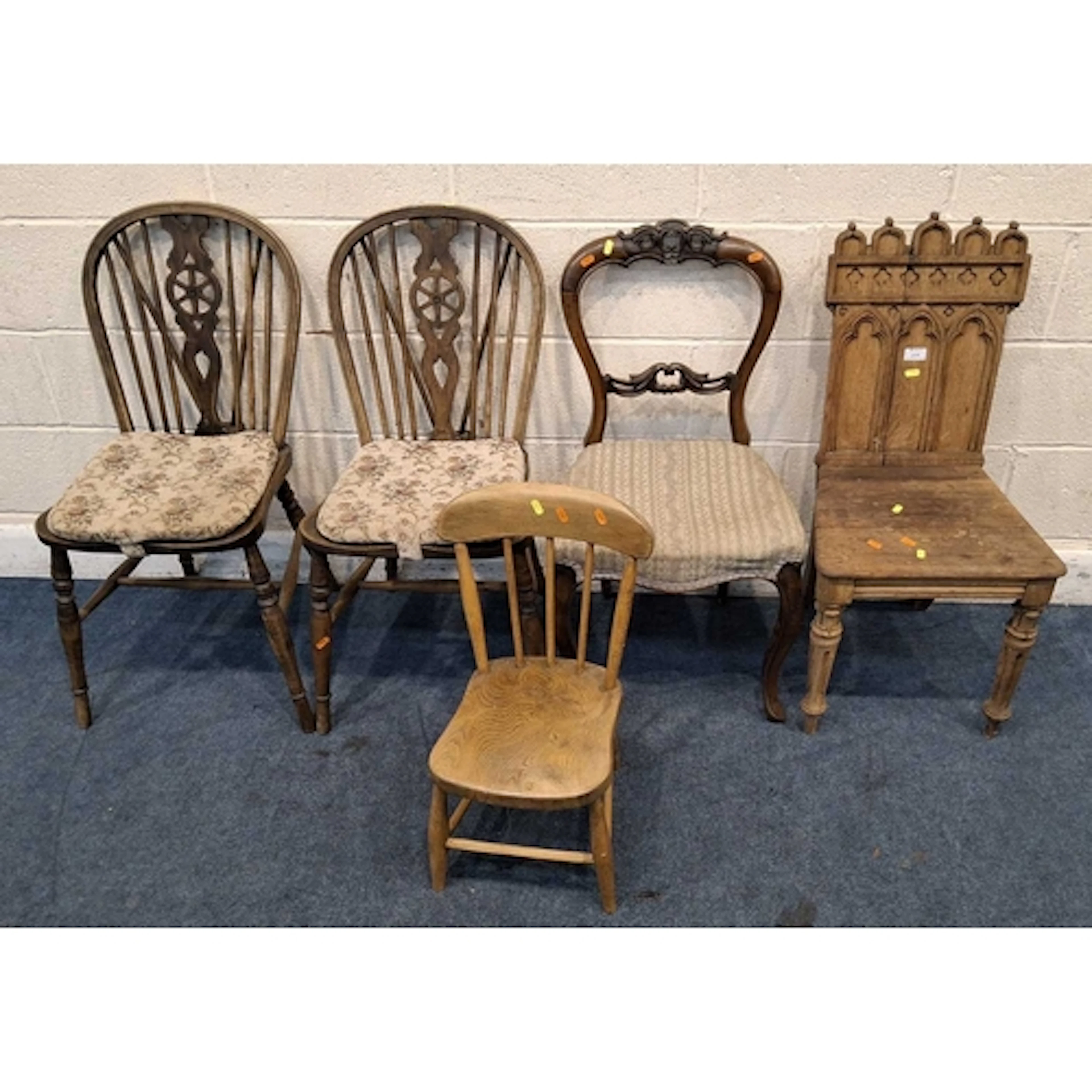 AN OAK ECCLESIASTICAL CHAIR, raised on fluted front legs, a ...