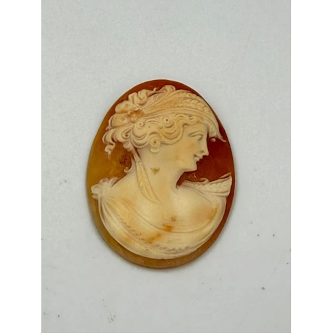 An unmounted Cameo of a lady in a classical pose, signed ver...