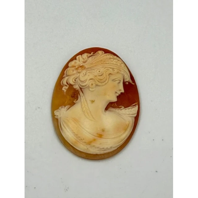 An unmounted Cameo of a lady in a classical pose, signed ver...