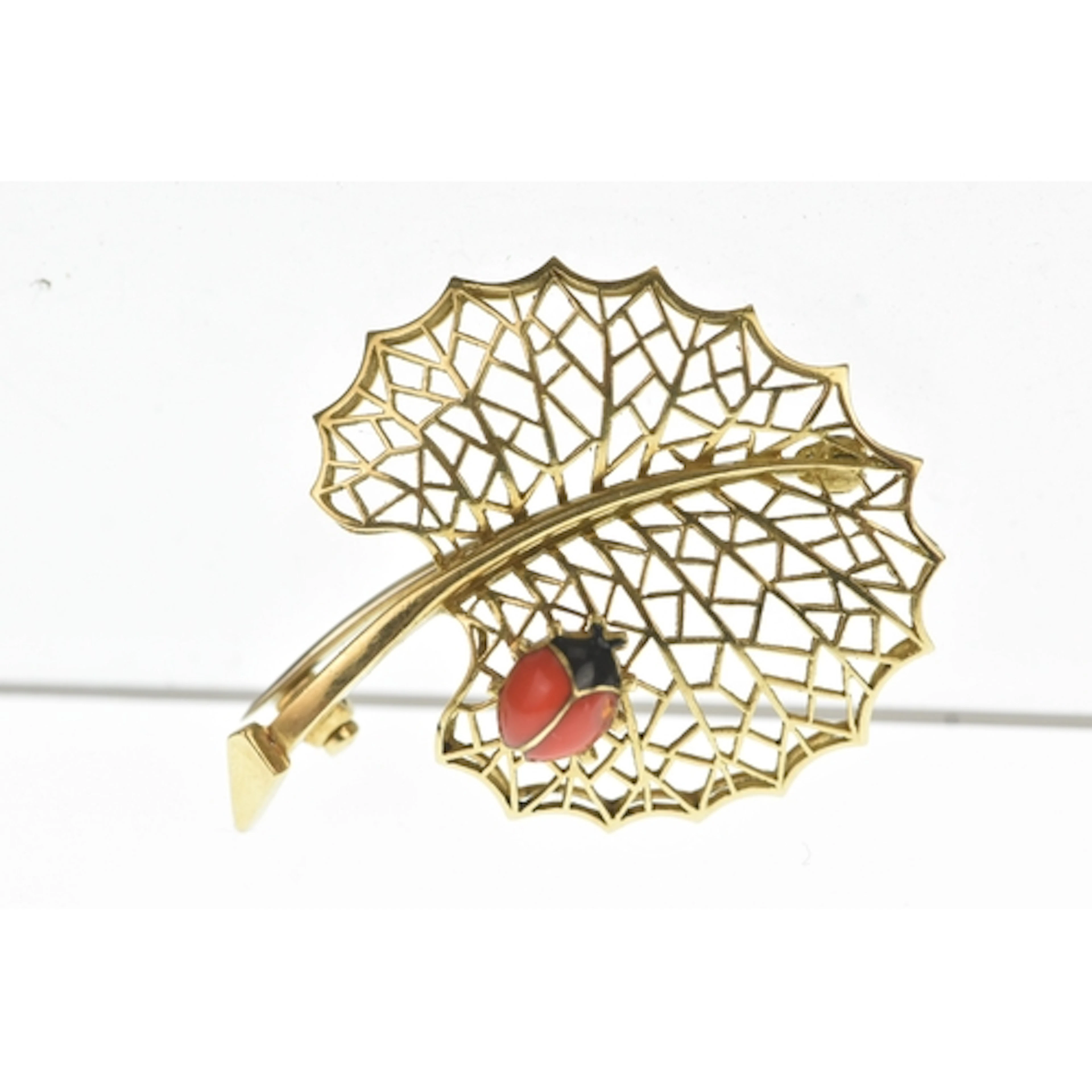 A Cartier style yellow gold leaf brooch, tested as 18ct gold...
