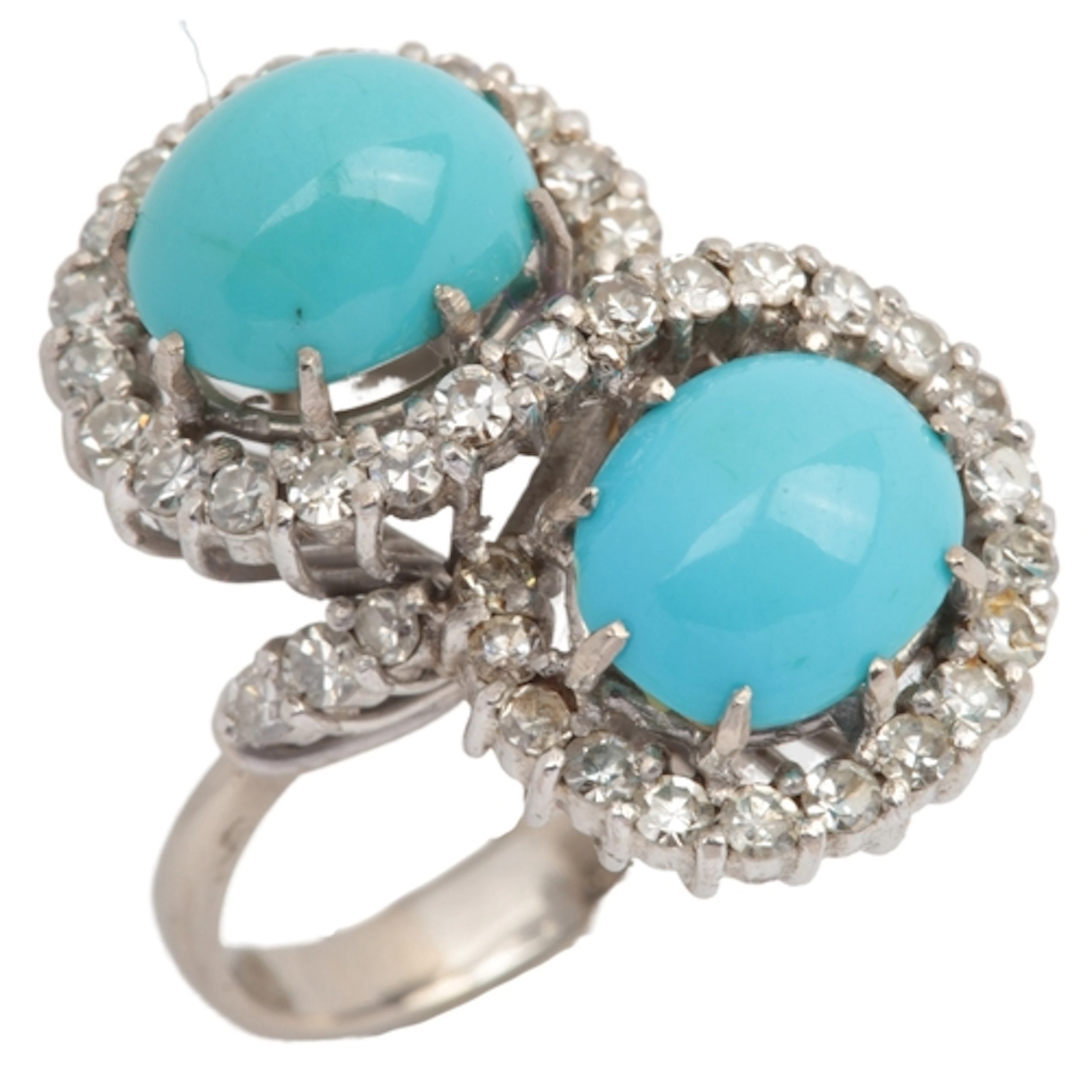 A turquoise cabochon and diamond ring, 1960s, of toi et moi ...