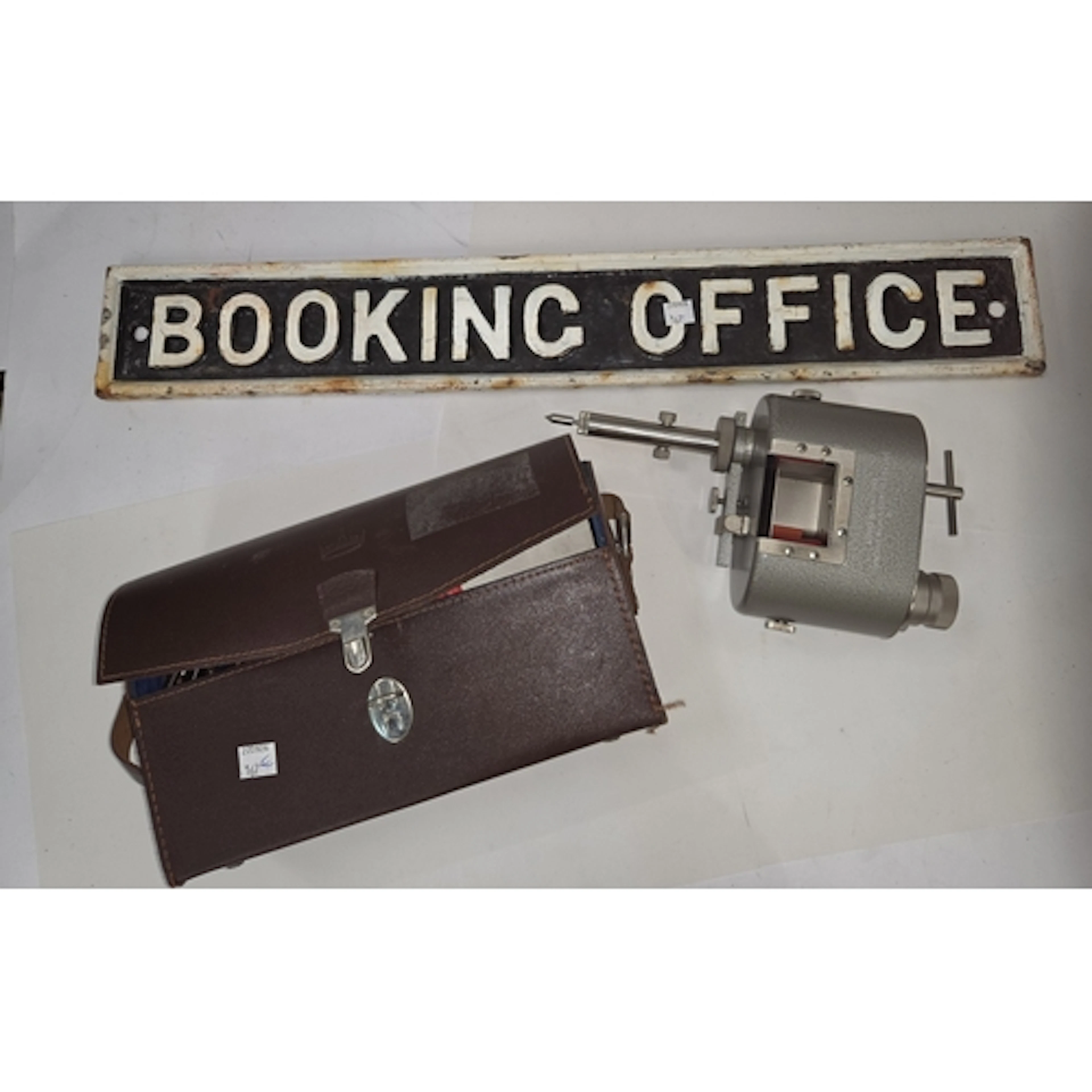 Cast metal sign 'Booking Office' and a cased handheld Vibrog...