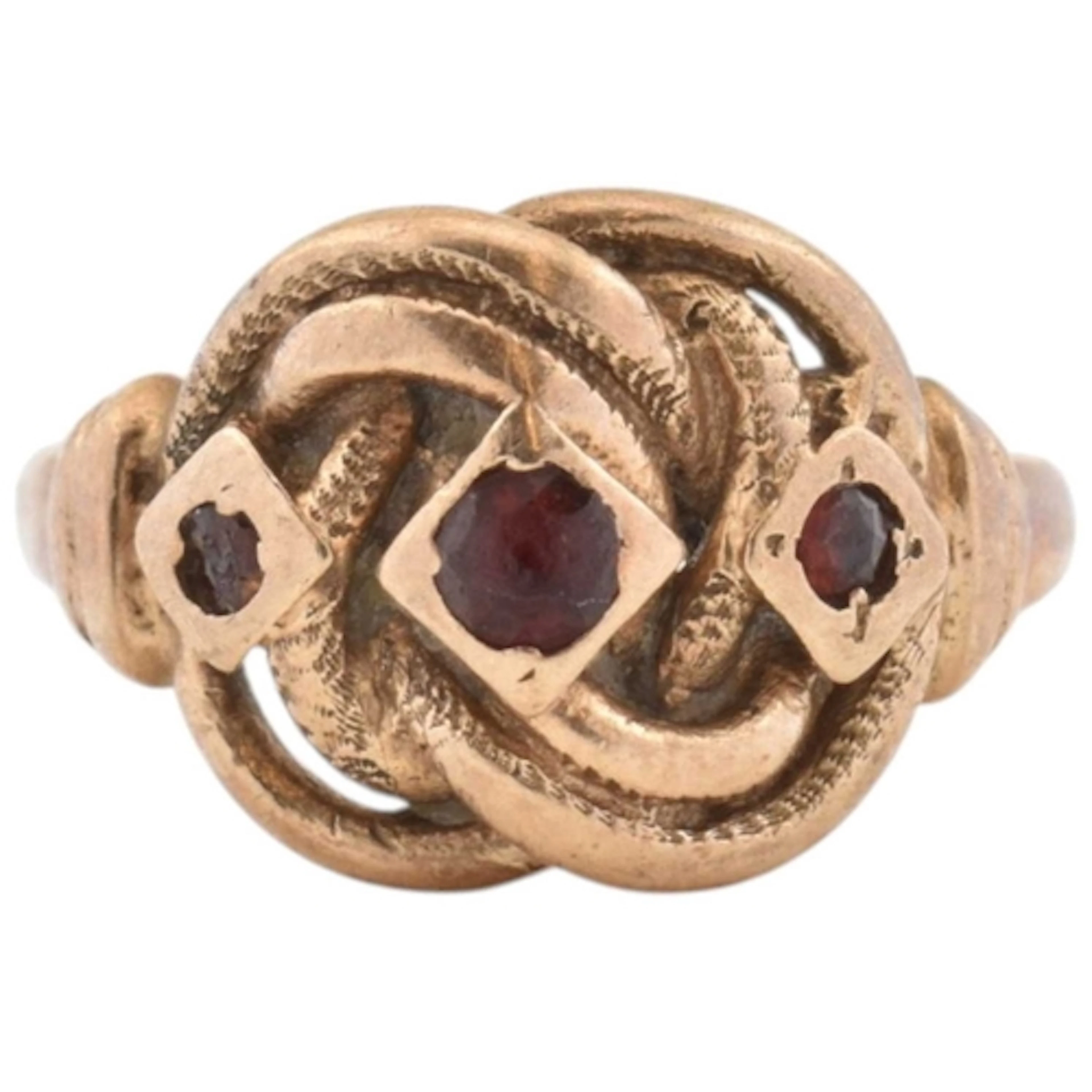 A 1970s hallmarked 9ct gold Celtic garnet knot ring. Hallmar...