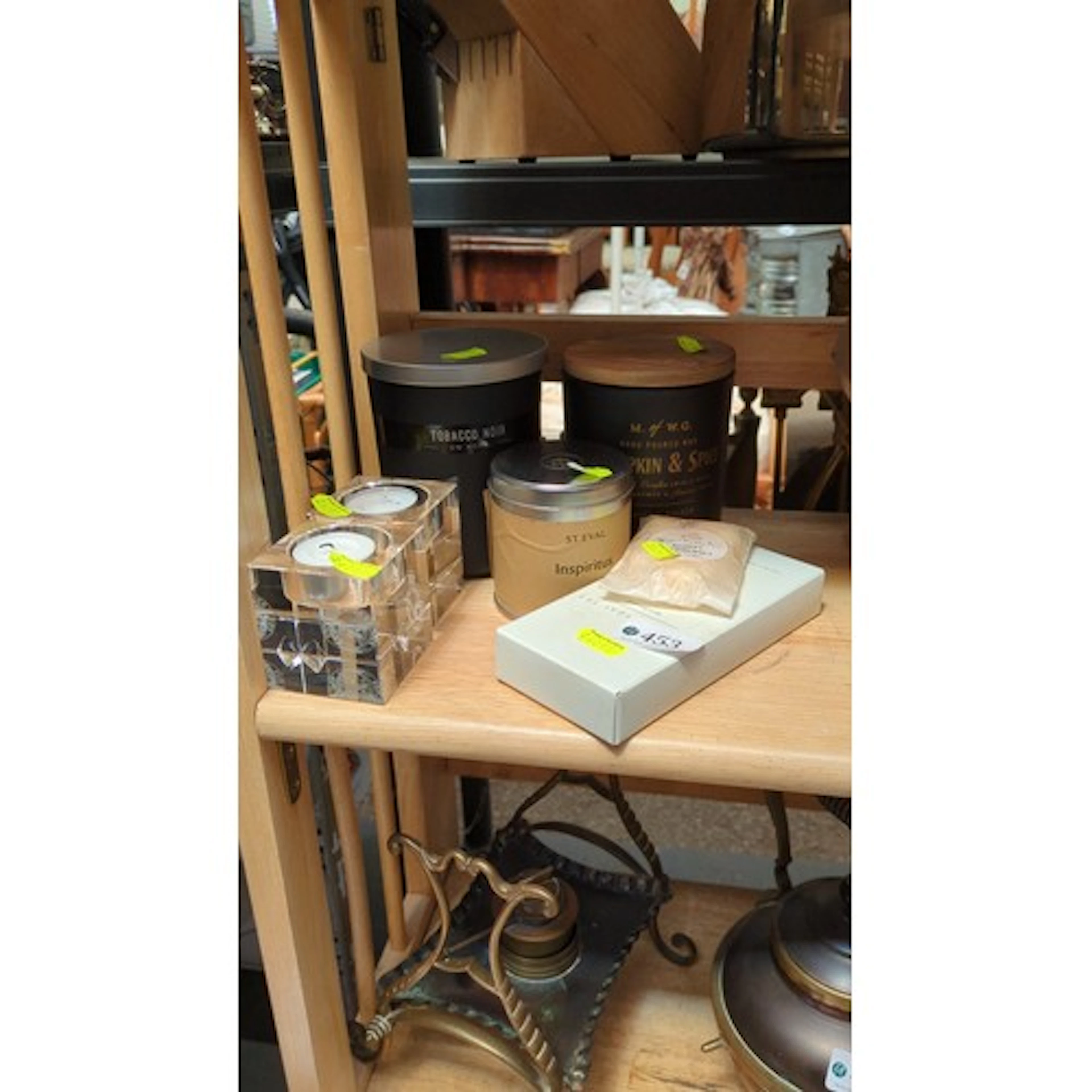 A group of scented home fragrance items comprising glass jar...