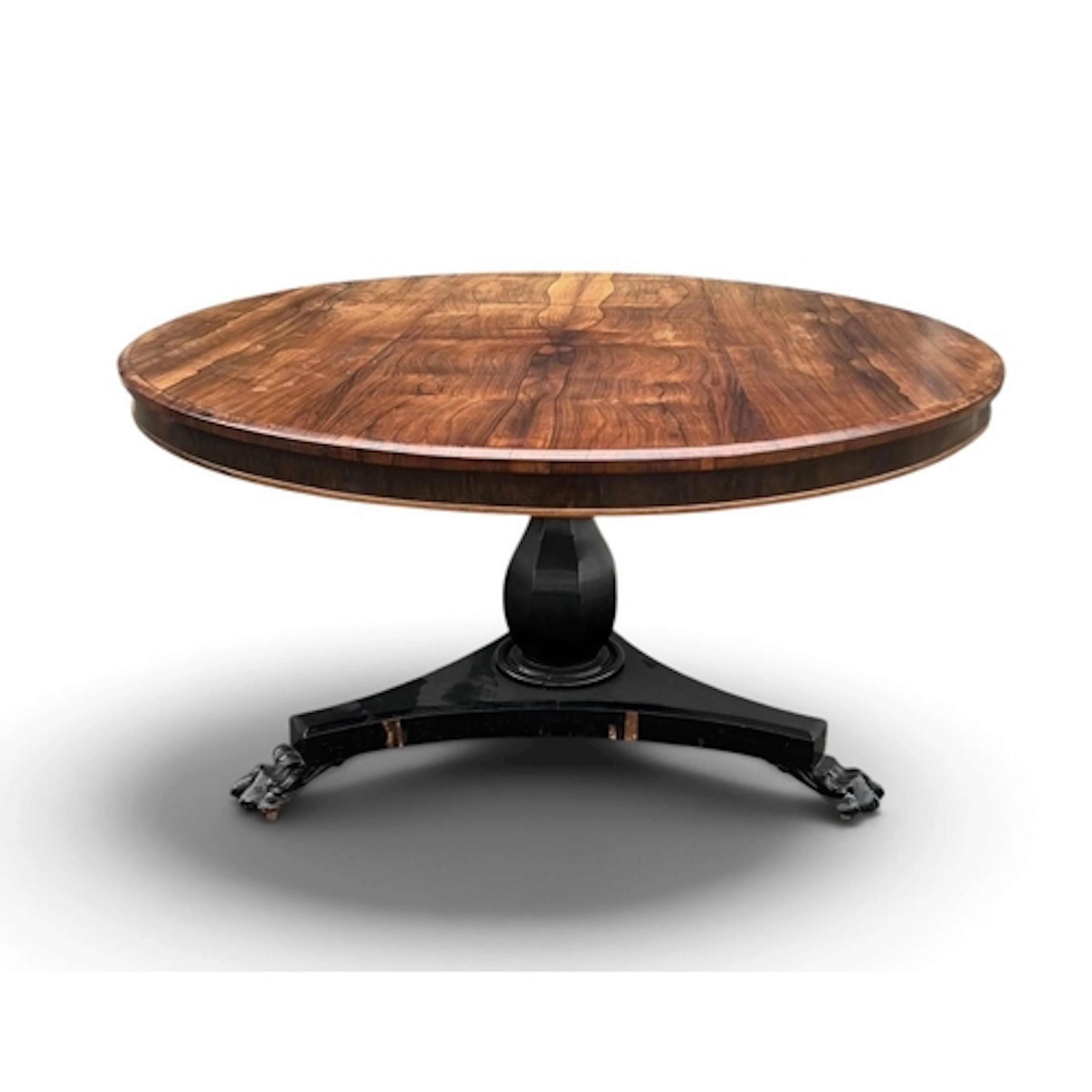 A REGENCY WALNUT ROUND BREAKFAST TABLE On an ebonised vase t...