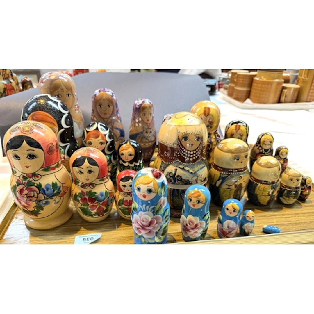 A collection of Russian Matryoshka wooden nests of dolls, on...